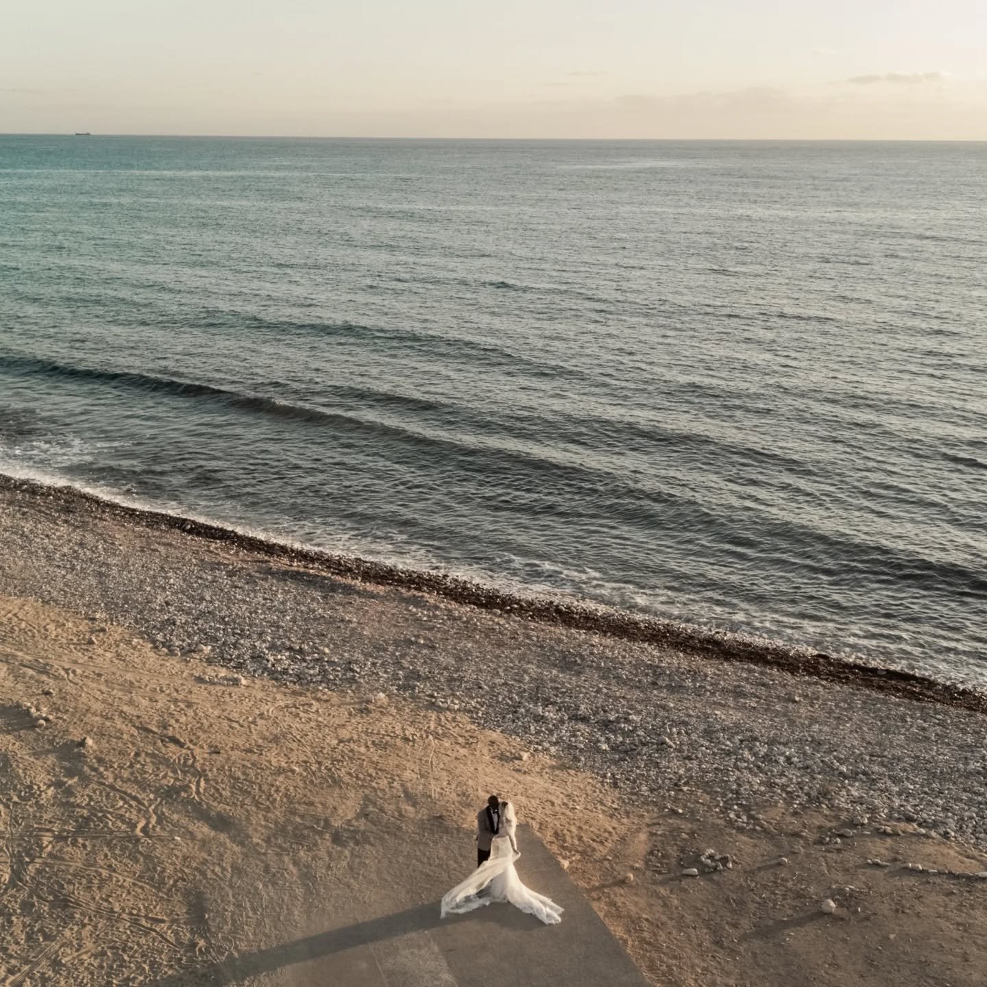 Your love, the sea breeze, and the sky as our canvas &mdash; captured from above for memories that last a lifetime. Drone magic for your perfect Cyprus beach wedding💍✨📸
.
.
.
#CyprusWeddingPhotographer #CyprusWeddings #droneweddingphotography #Paph