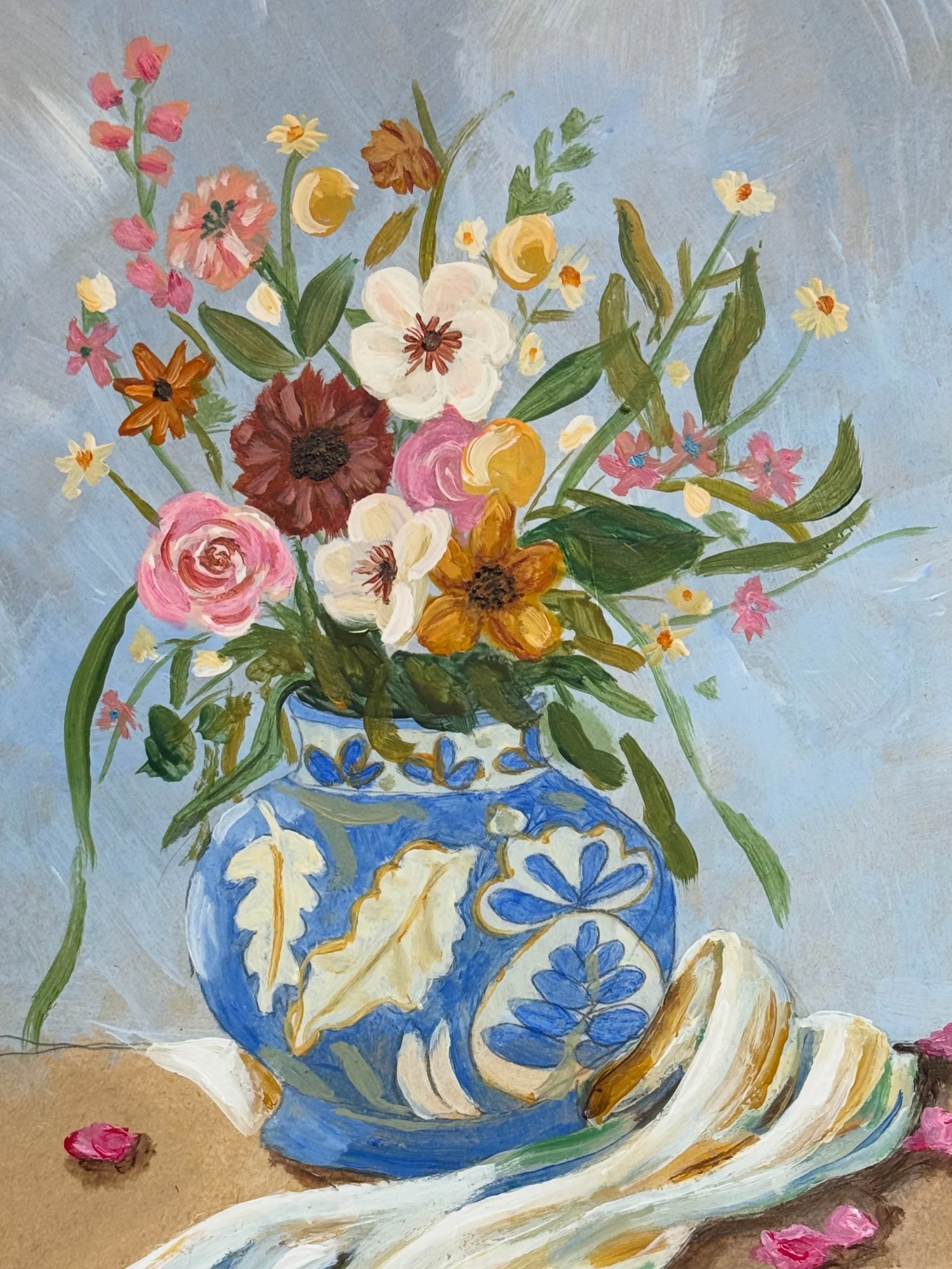 A painting of a flower arrangement in a blue and white vase on a table, with pink flowers scattered around.