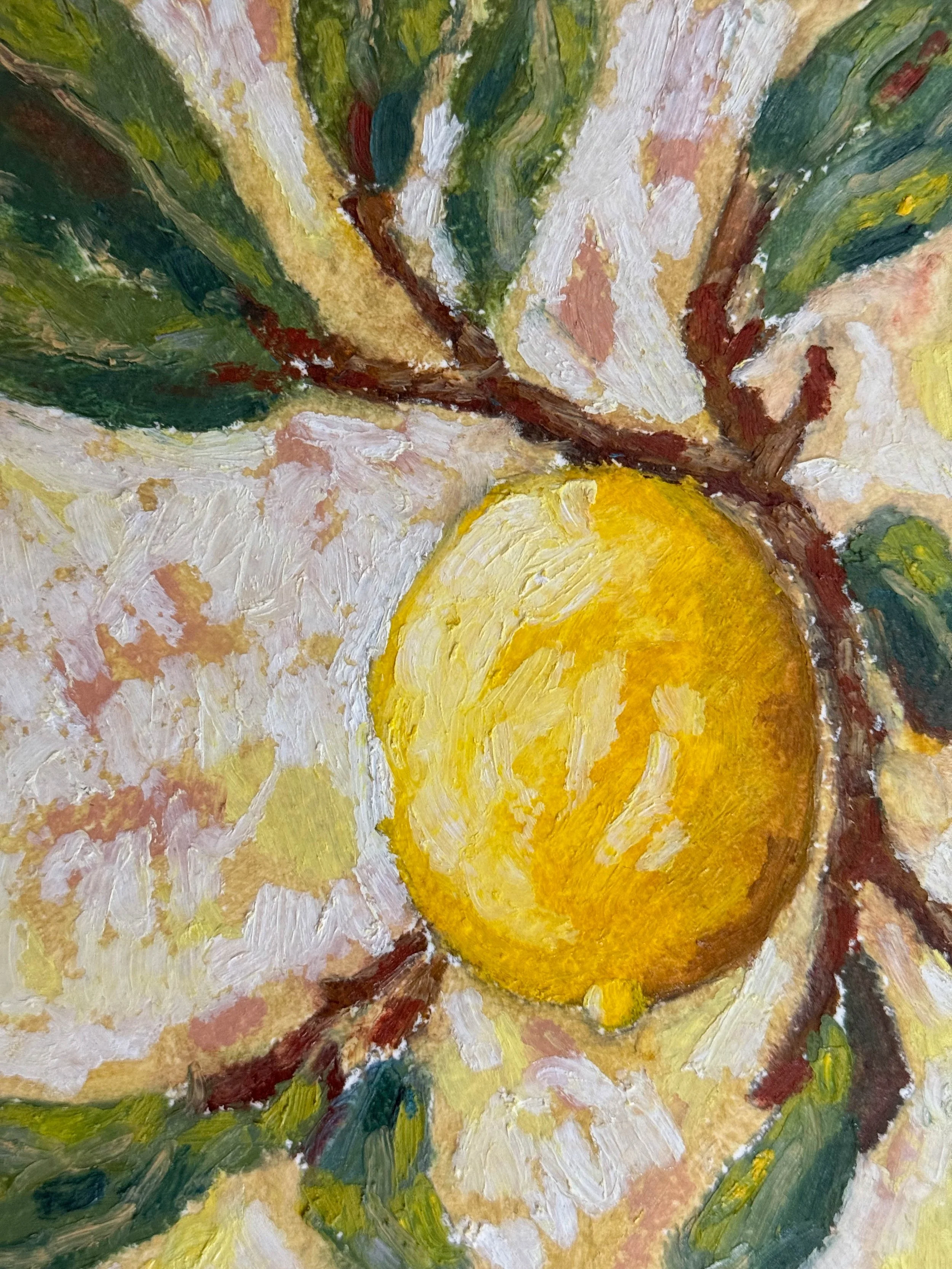 Close-up of a still life painted in an impressionist style, featuring a lemon and green foliage with a textured, colorful background.