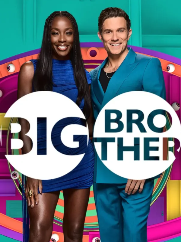Two hosts, a woman and a man, standing together for the TV show 'Big Brother.' The woman is wearing a blue dress, and the man is in a matching blue suit. The background features colorful, playful elements with eyes and vibrant patterns.