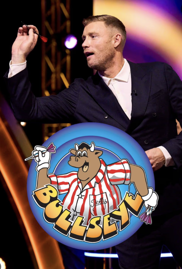 A man in a dark suit and white shirt holding darts on a stage with colorful lights, with the Bully Bulldozers logo overlayed at the bottom, featuring a cartoon bull in a striped pajama shirt holding darts and the word "Bully".