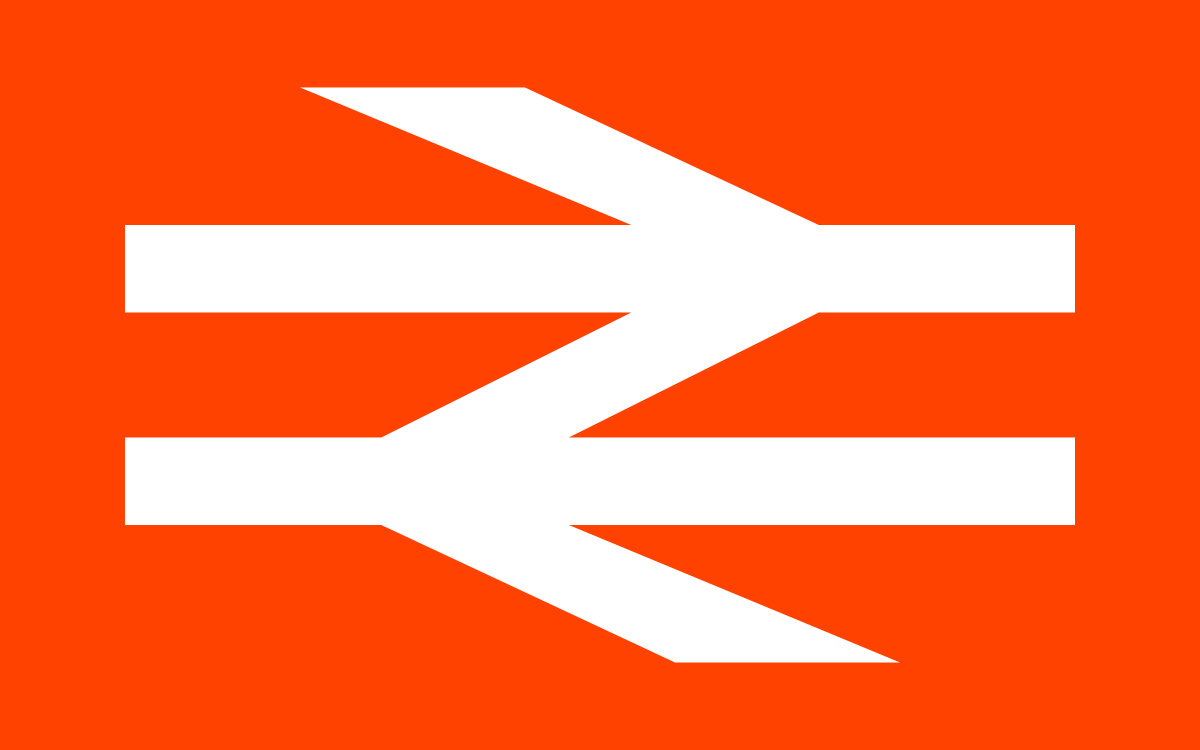 Airline warning sign with two white arrows pointing left on an orange background.