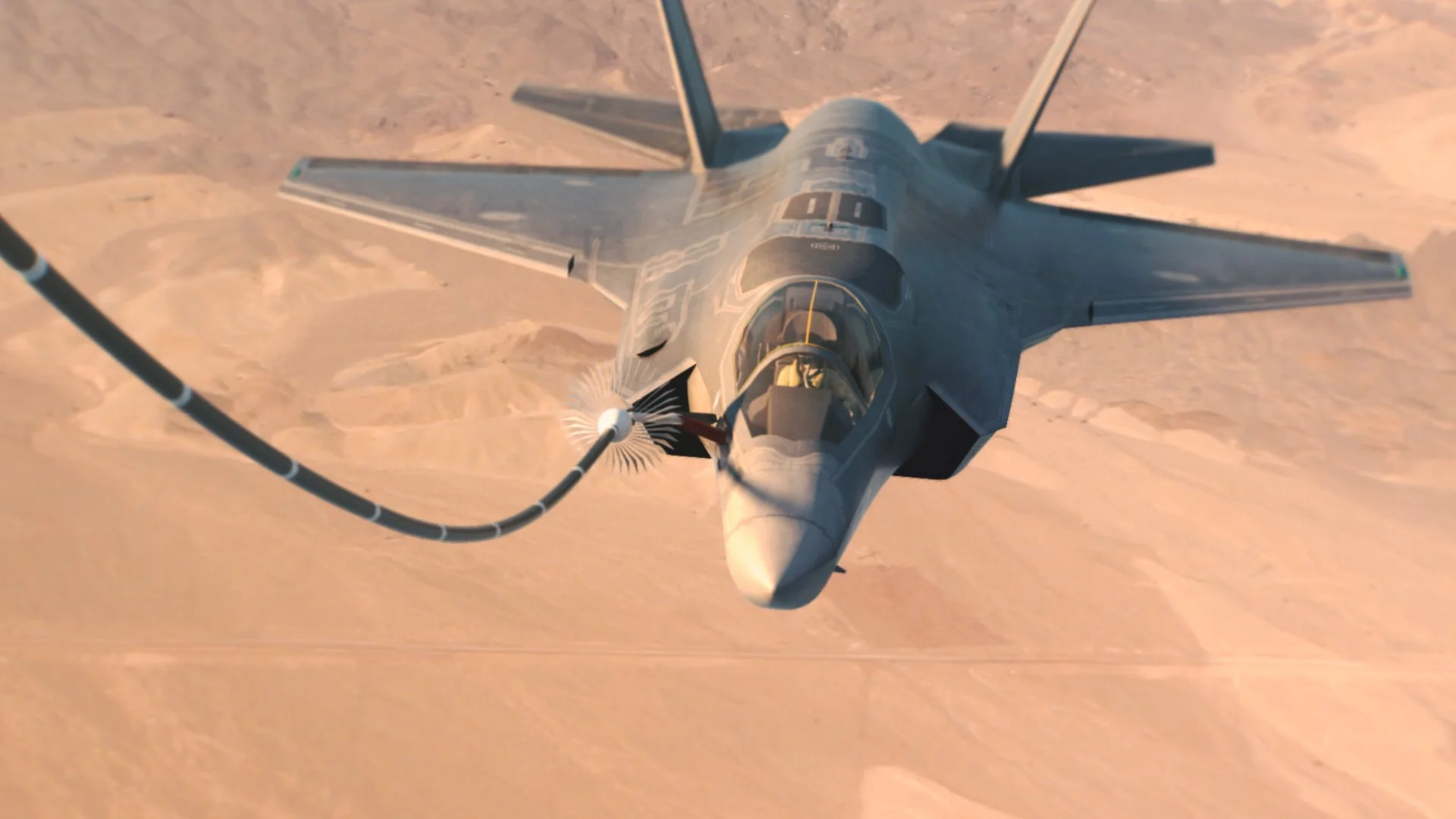 An F-22 fighter jet flying over a desert landscape.