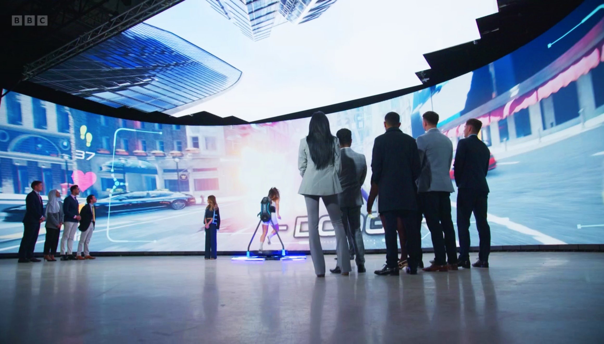 A group of business people observing a virtual reality demonstration in a Volume made by Parachute Studios