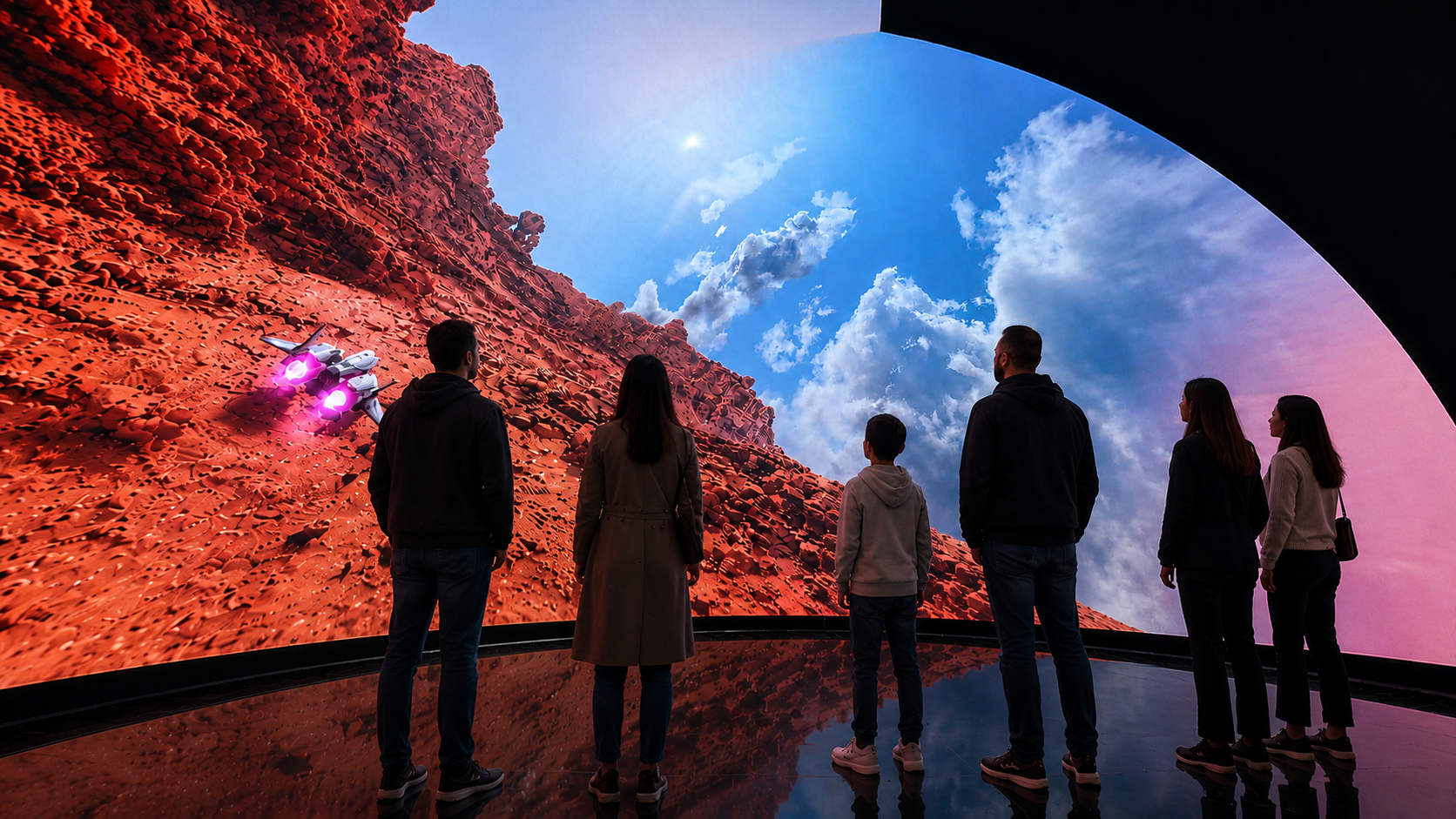 Group of people viewing a large digital LED screen showing a sci-fi landscape on a 270 immersive LED dome Parachute Studios