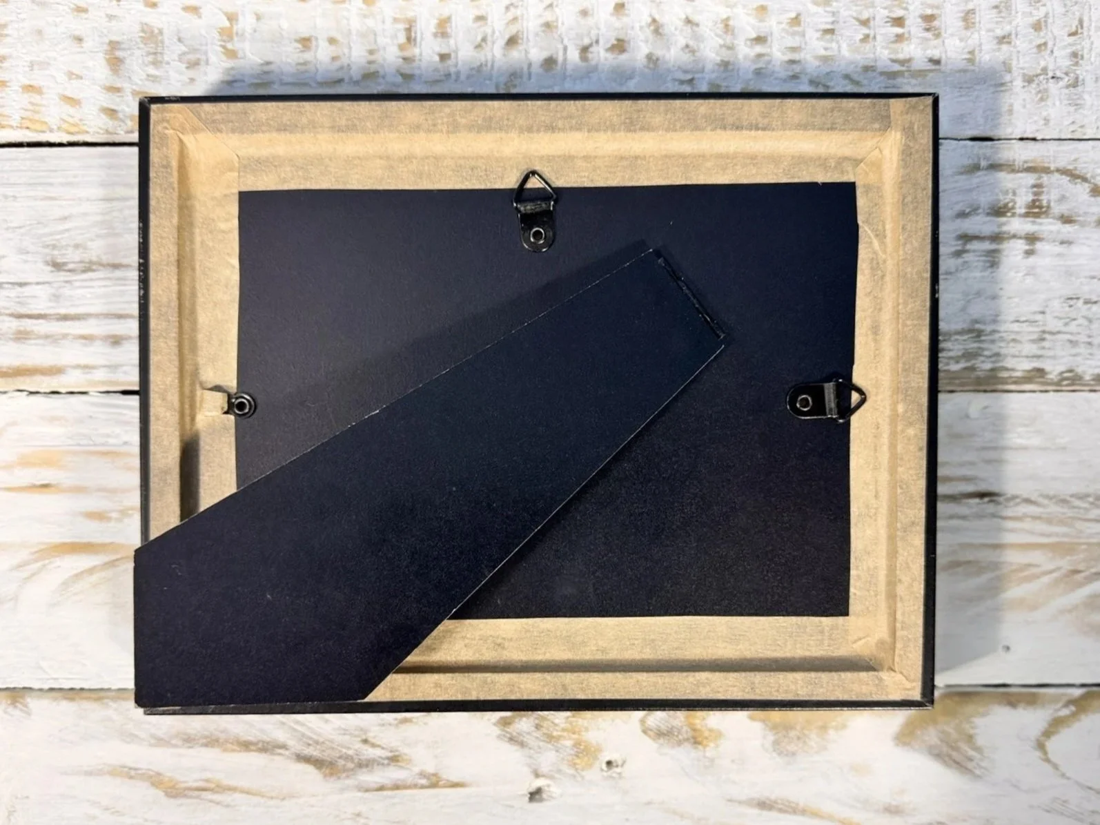 back of framed textile of indonesian batik sarong