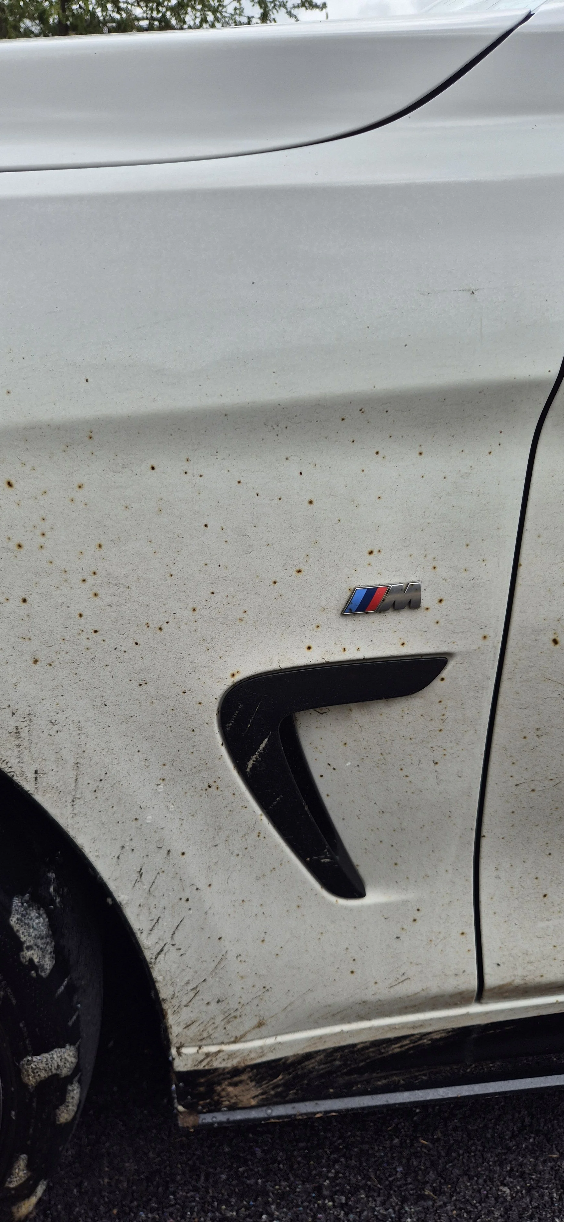 White car with tar all of it..