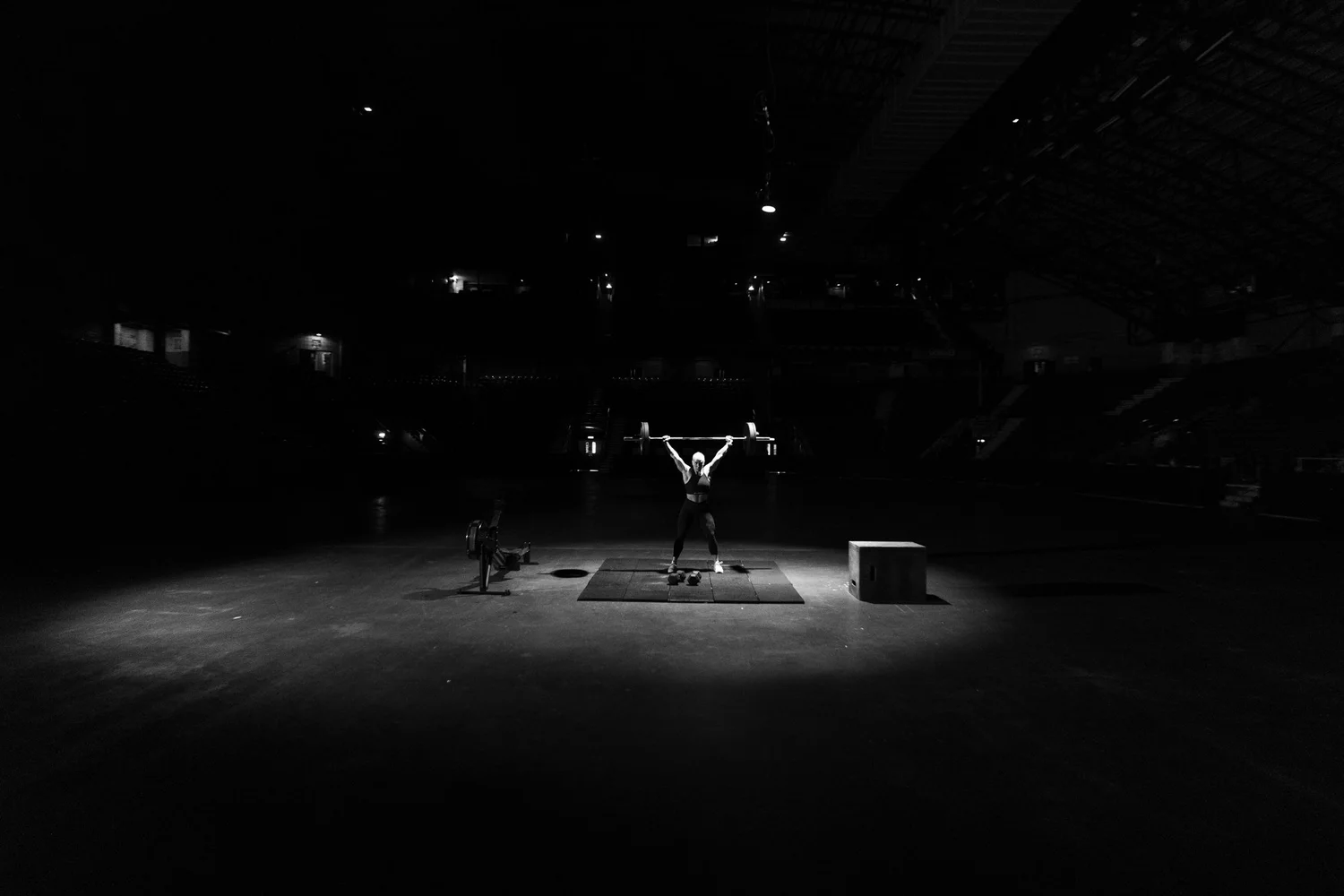 Athletes competing under the arena lights