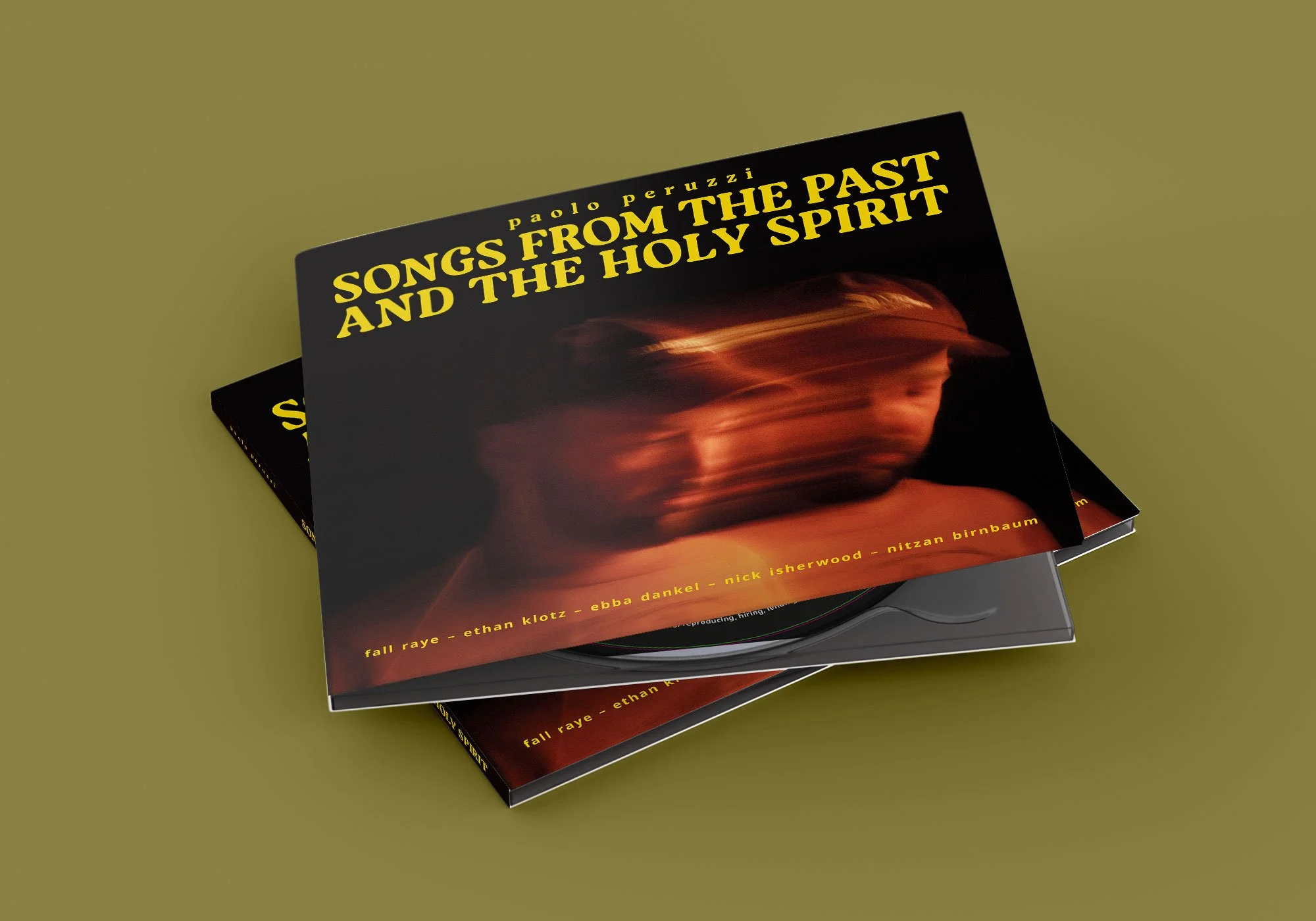 Zwei Vinyl-Schallplatten mit schwarzem Cover, darauf ein verschwommenes Gesicht und gelbe Schrift, die Titel "Songs from the Past and the Holy Spirit" anzeigen.