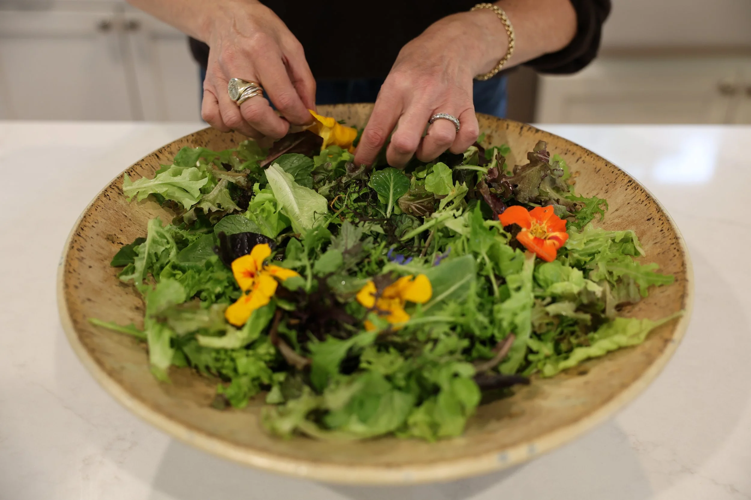 SHANNON SHIELDS MAKING SALAD WITH EDIBLE FLOWERS.JPG