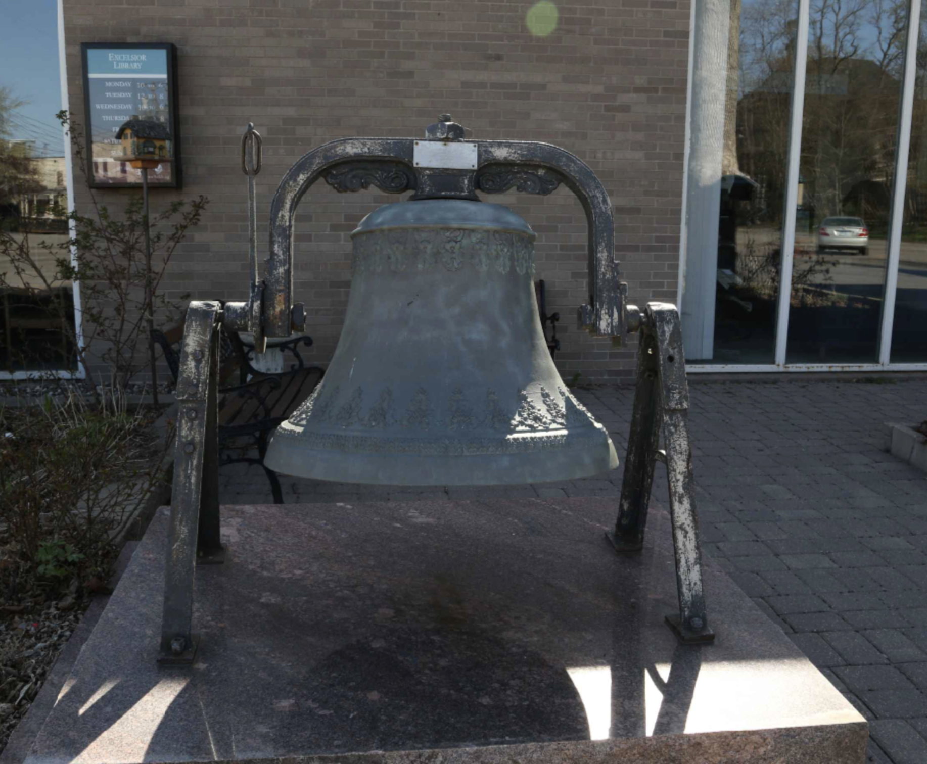 Belle's bell on display outside Excelsior Library