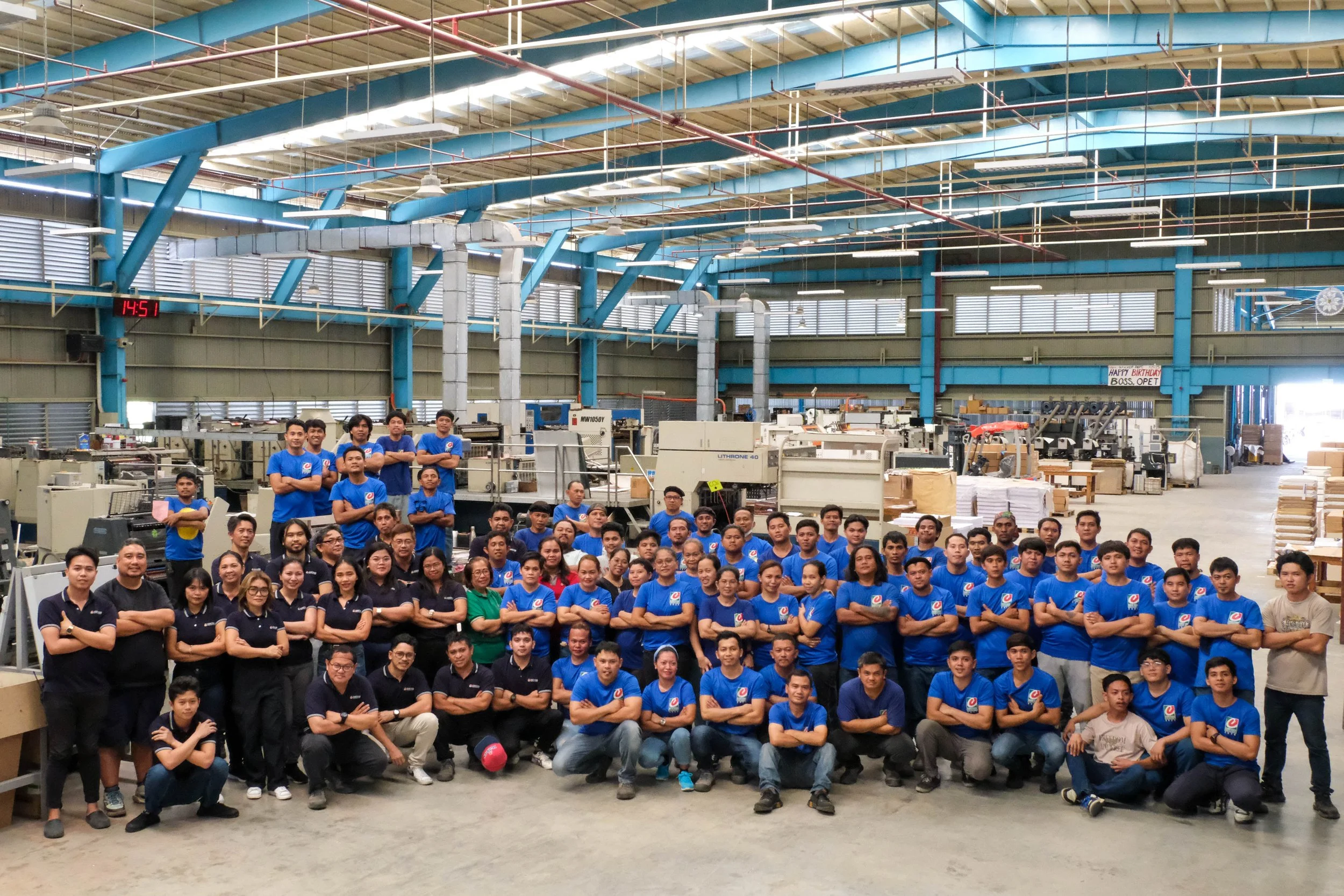 Group photo of the Cortess Printing factory staff and experienced employees in Davao City, reinforcing company history and team expertise since 1965.