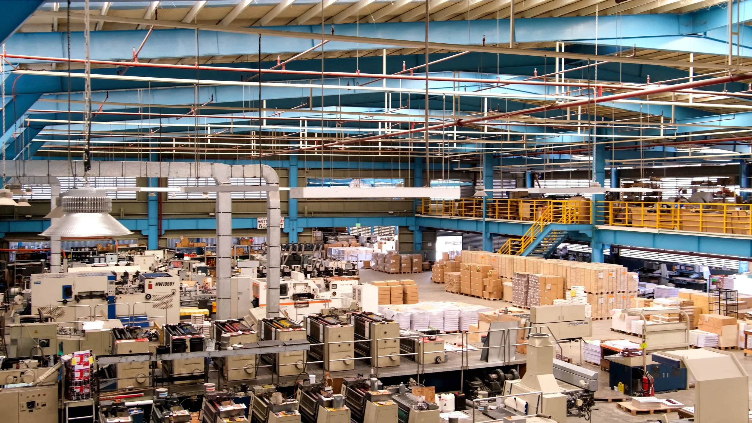 Wide view of the Cortess Printing industrial factory floor in Davao, showcasing large-scale machinery and high-volume commercial and packaging capacity.