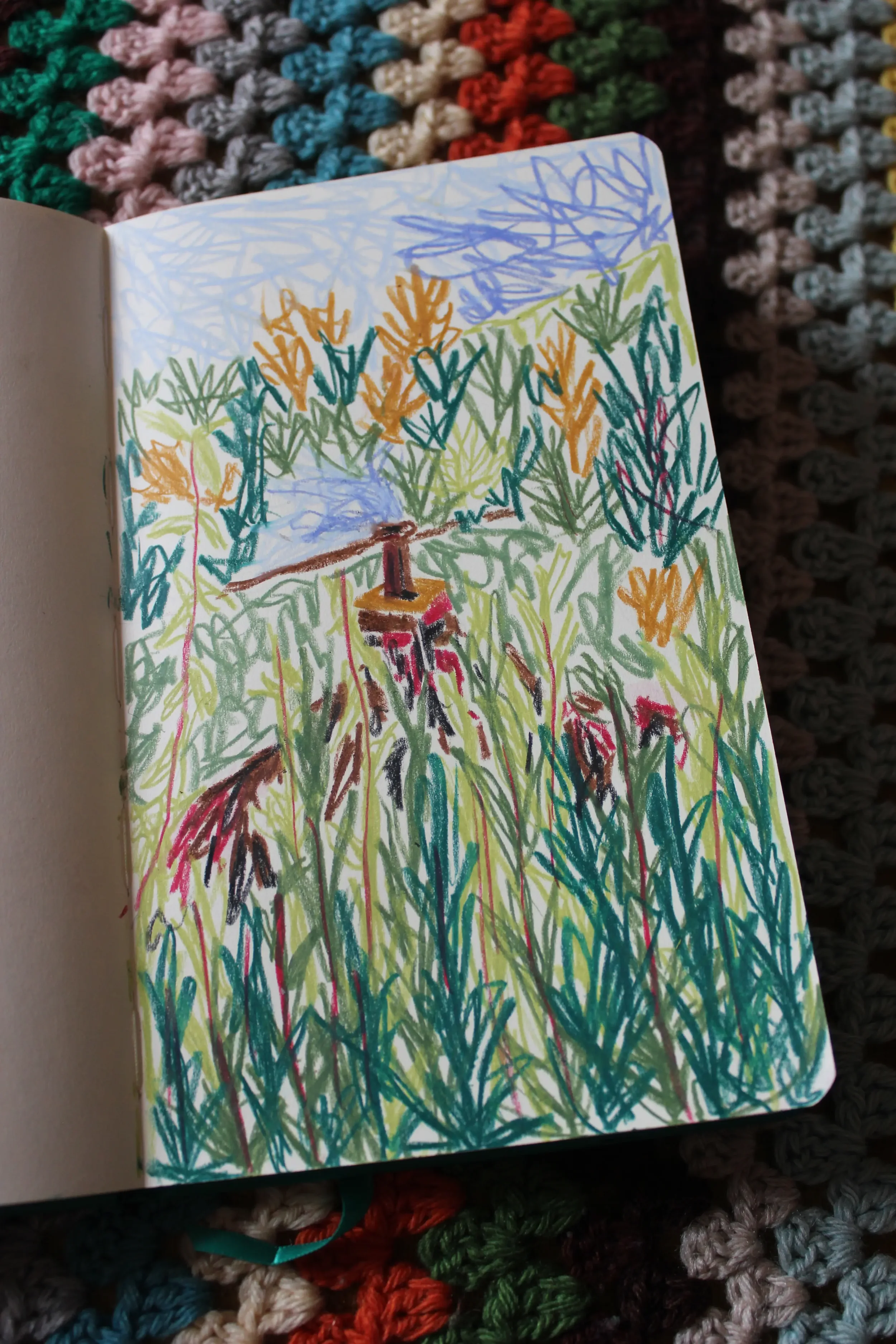 A colorful drawing of a landscape scene with green grasses, yellow and orange bushes, a brown and teal tree, blue sky and clouds, and a house with smoke coming from the chimney.