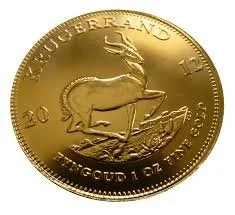 A gold coin with a pronghorn antelope and the text 'KUQUERLAND TRUST 20' and 'TUNGOLD 1 OZ FINE GOLD' around the edge.