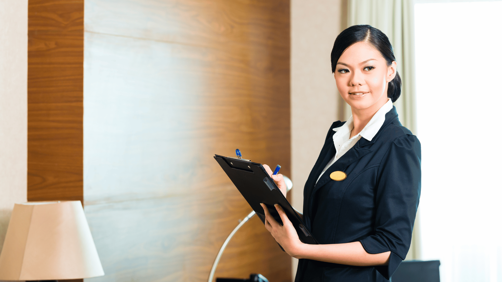 An executive housekeeper inspecting a room