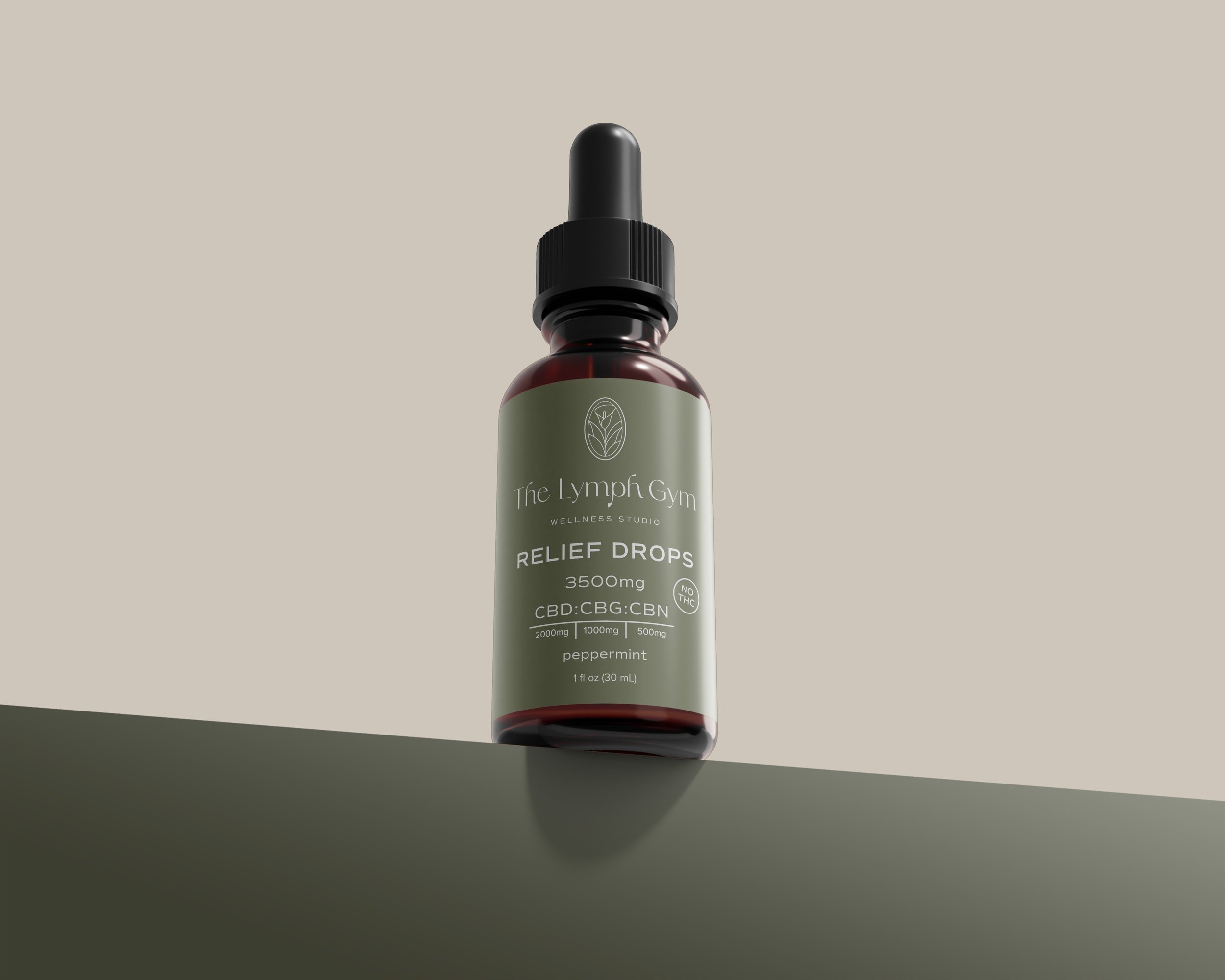 A small dark amber glass bottle with a black dropper cap, labeled 'The Lymph Gym Wellness Studio Relief Drops 3500mg CBD:CBG:CBN peppermint', standing upright on a matte surface against a neutral background.