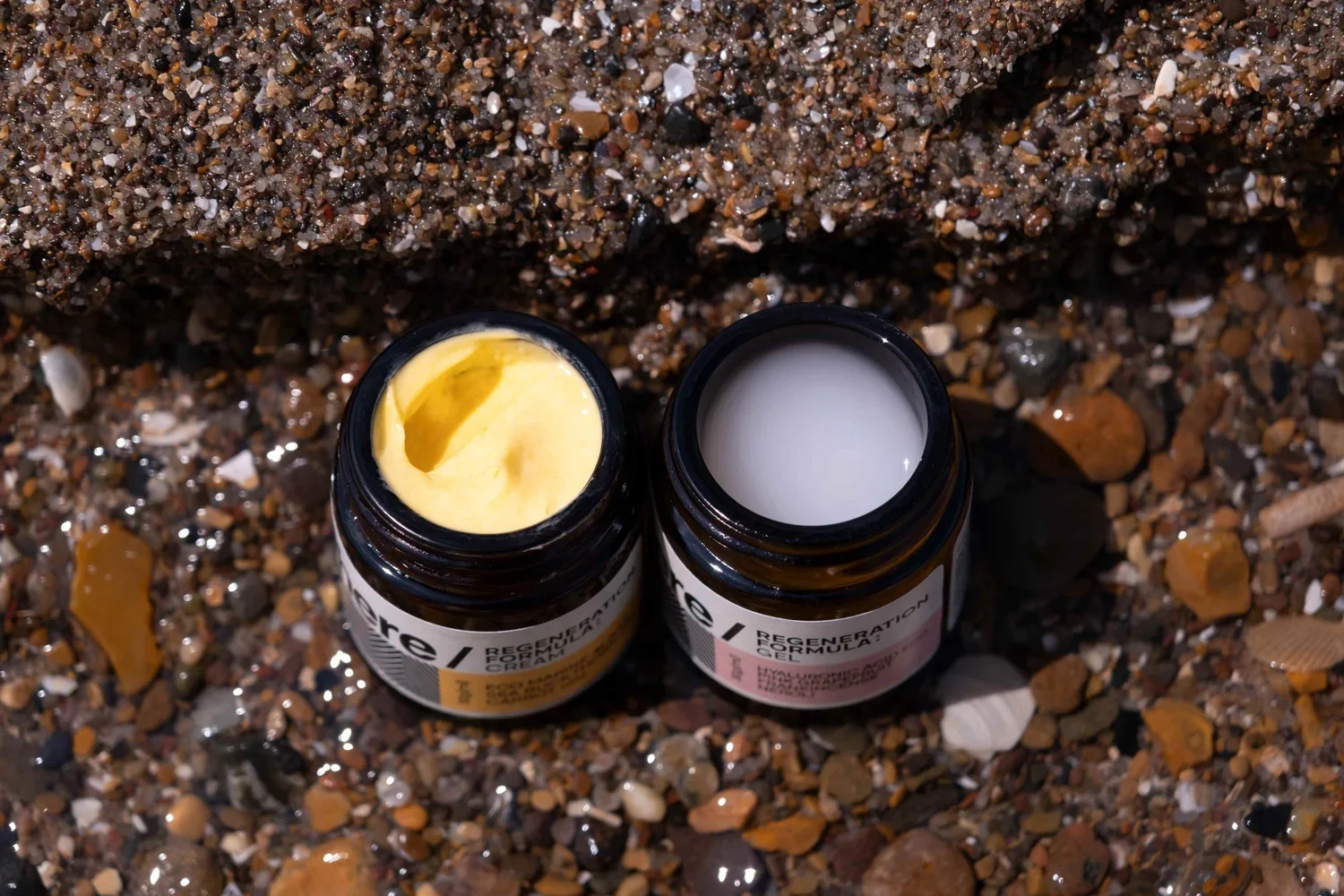 skincare product jars on beach