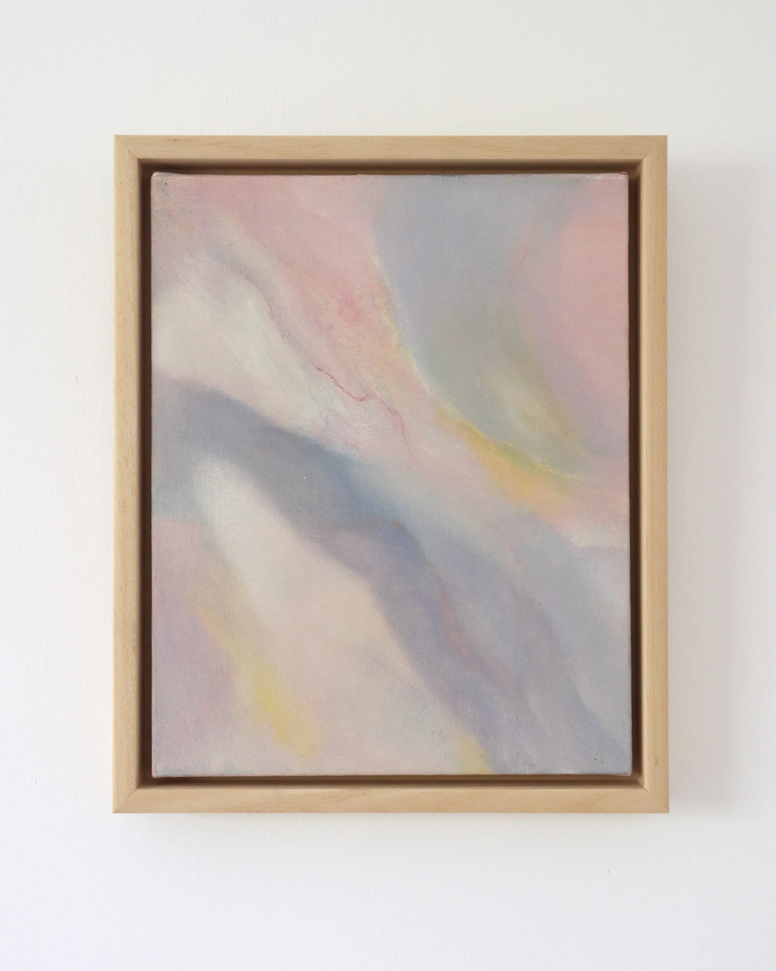 small abstract painting showing streaks of blue, pink, cream and yellow in a wooden frame