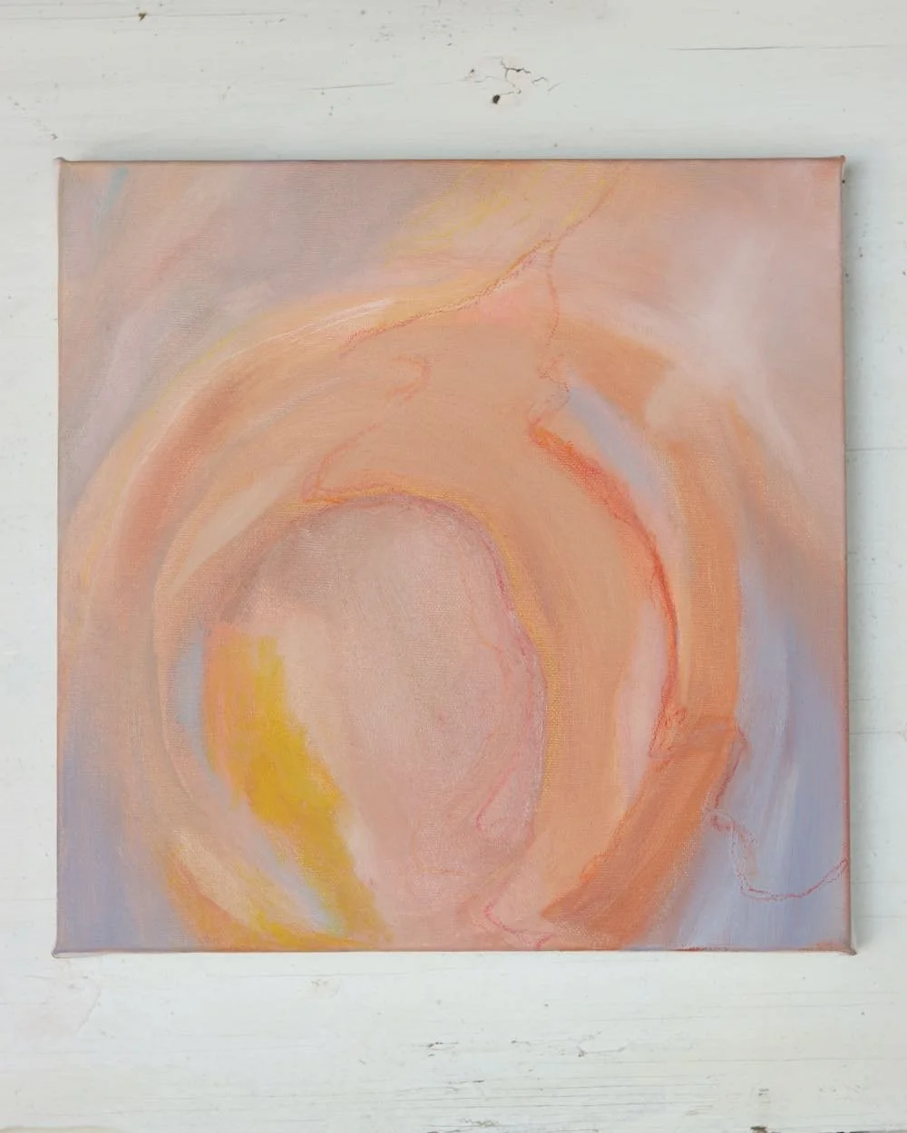 abstract painting with blue, orange and yellow making a circle