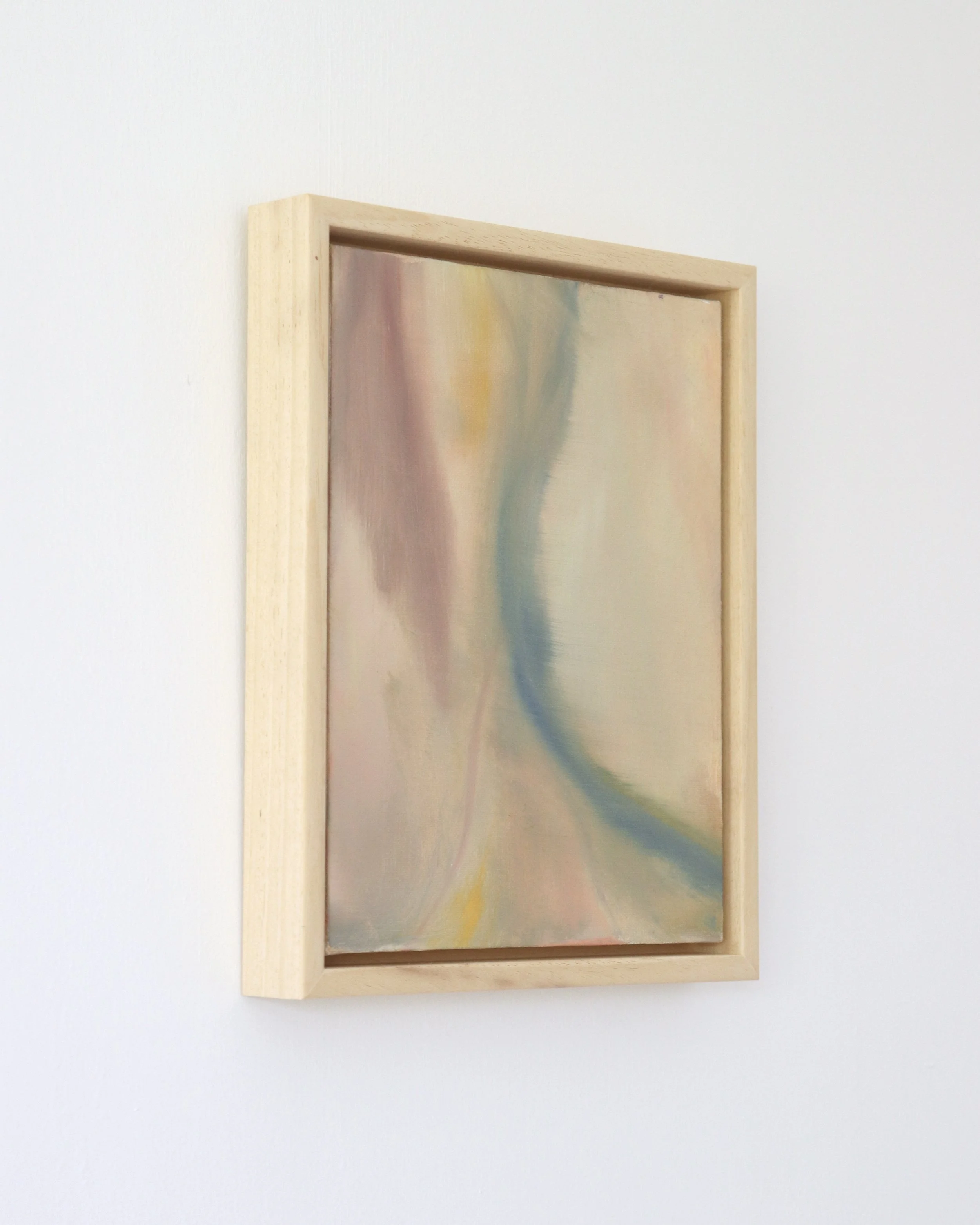 side view of abstract painting in wooden frame