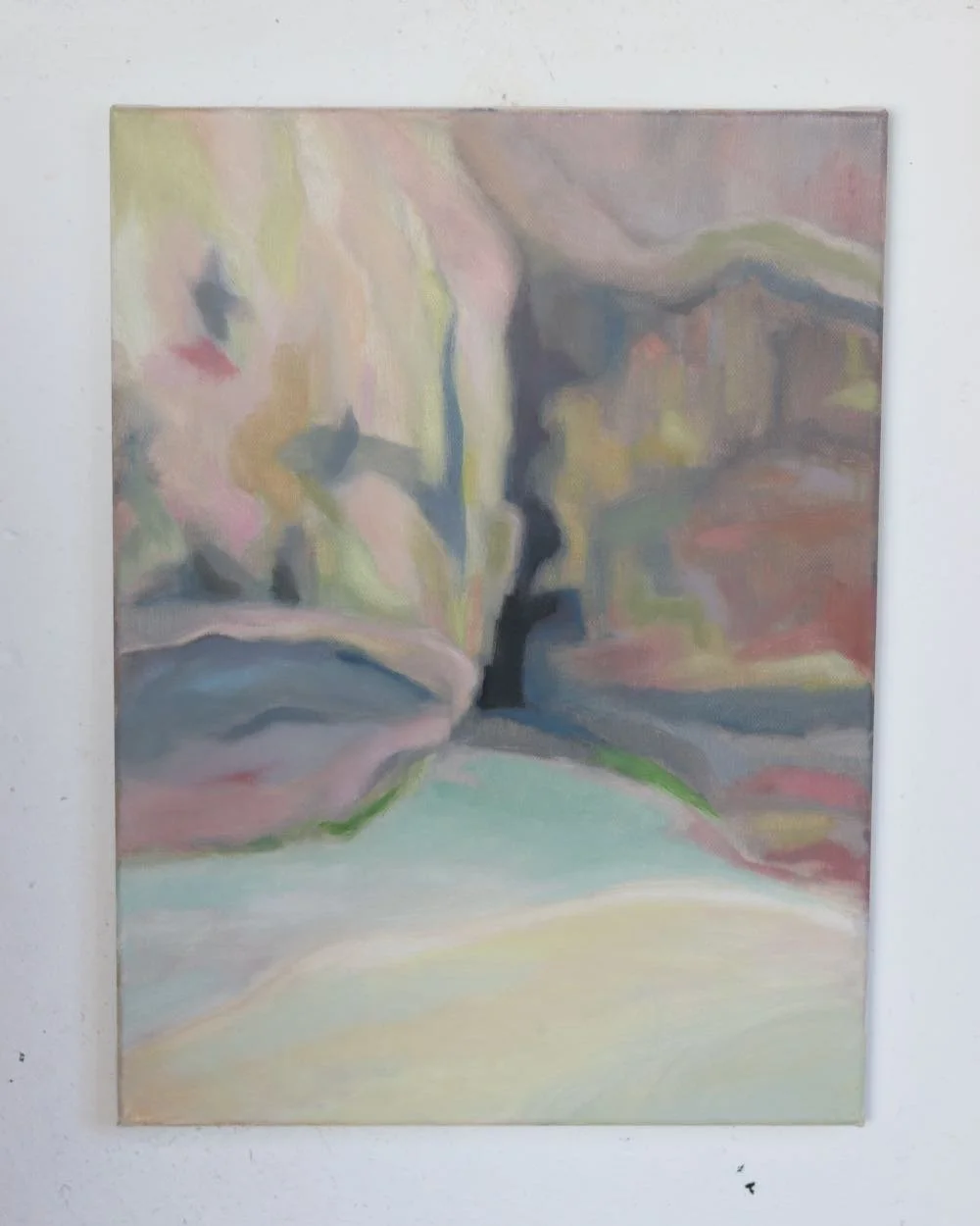 a colourful painting of a cave entrance with a pool of water