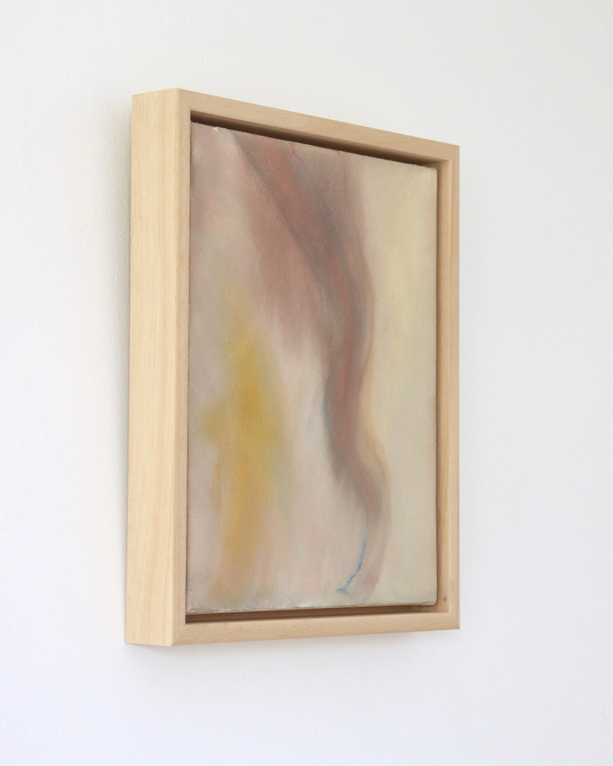 side view of abstract painting in wooden frame