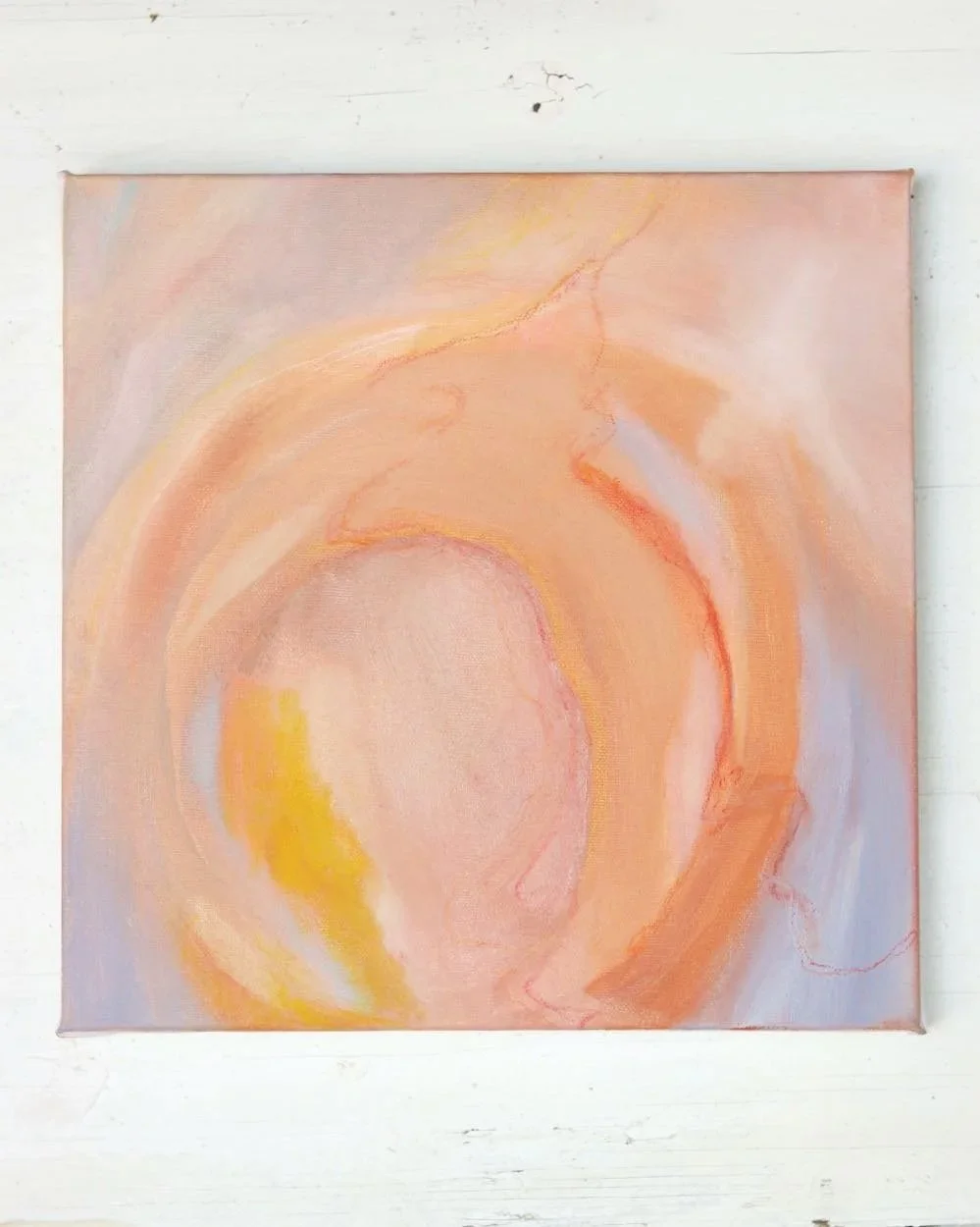 abstract painting with blue, orange and yellow  making a circle