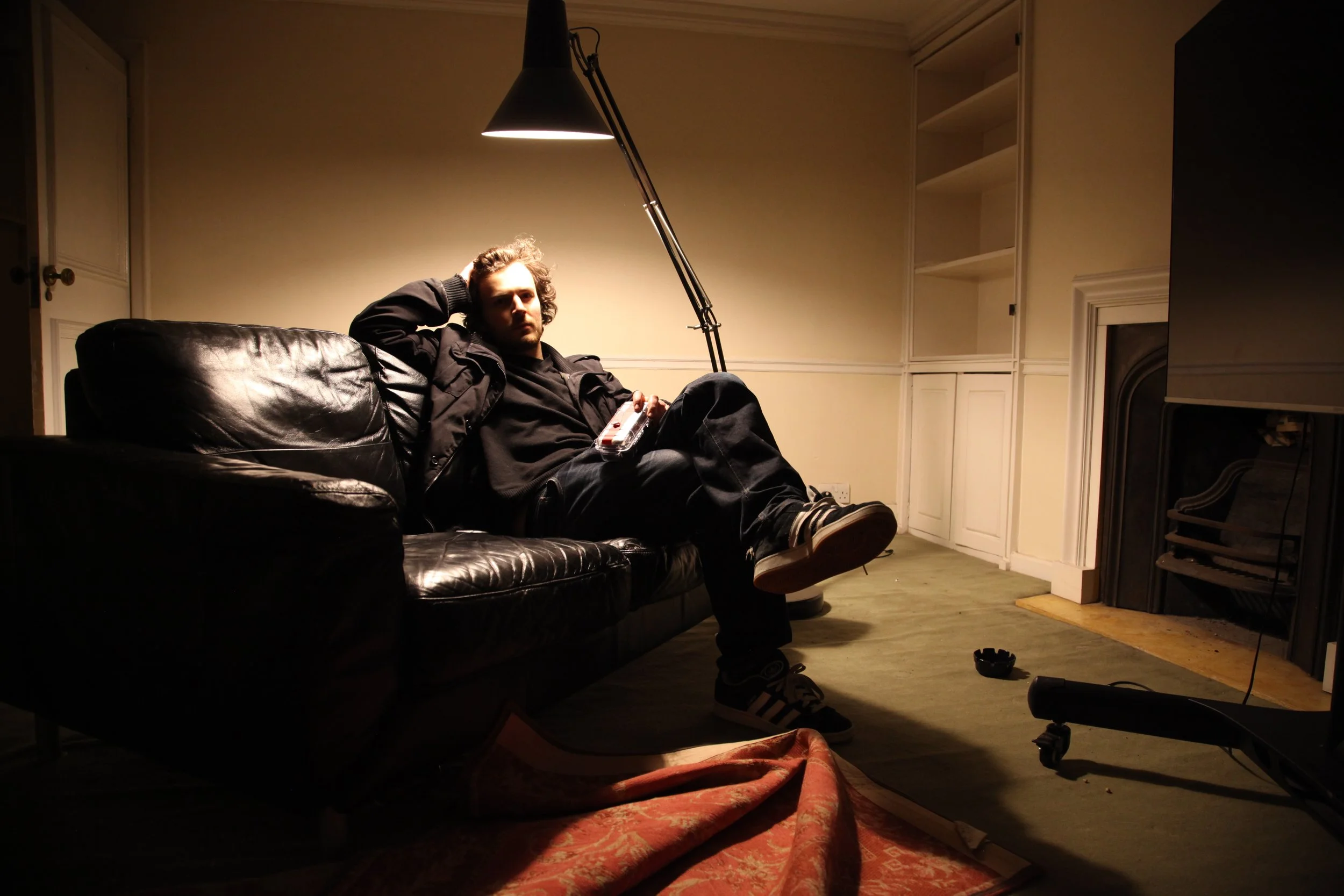 Lucas (Director) on the black sofa.