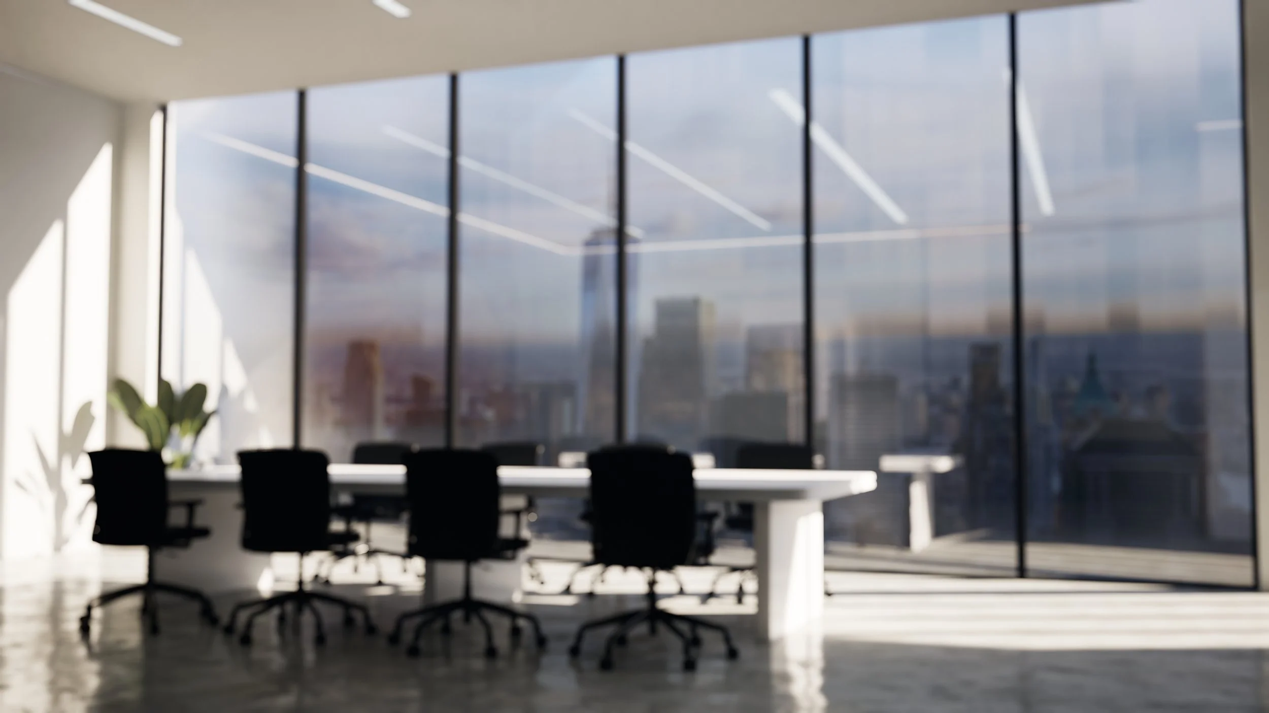Modern office conference room with a long white table and six black chairs, large floor-to-ceiling windows with a city skyline view, and a potted plant in the corner.