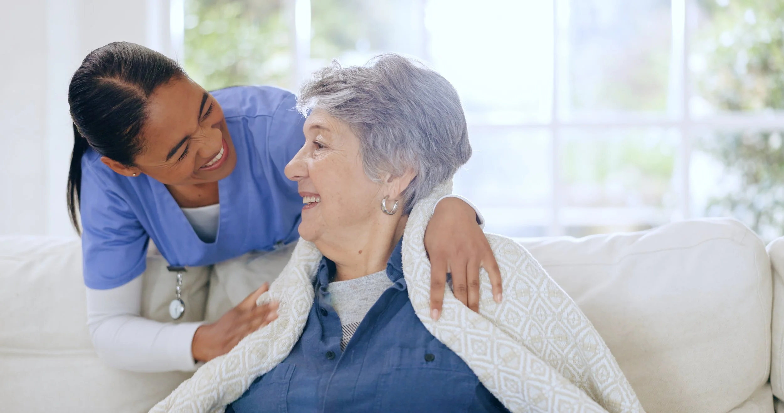A caregiver with an elderly woman