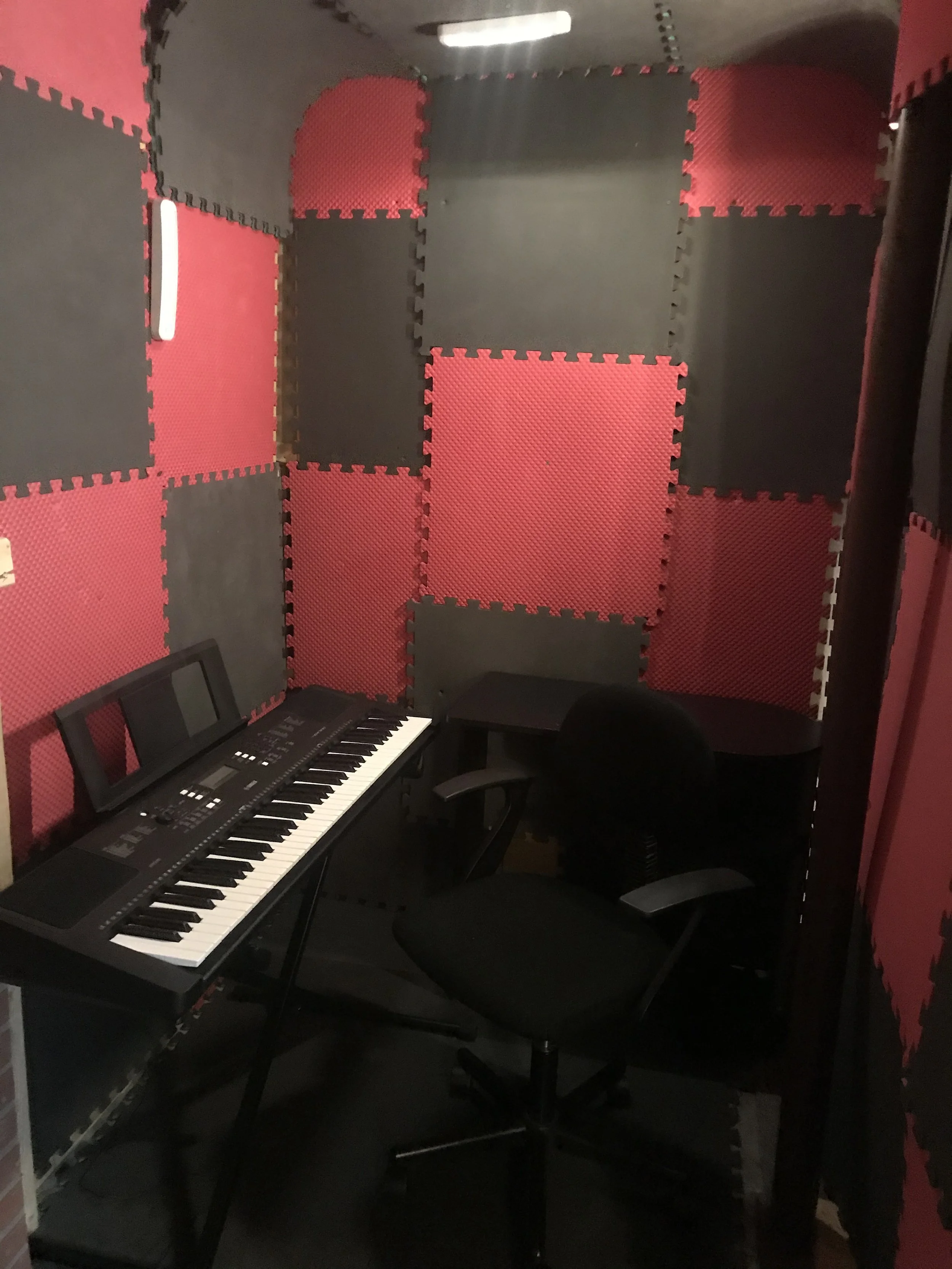 Humble beginnings... This is my first studio I had in the basement, just a small corner, a desk, a keyboard, a mic... and a dream.
