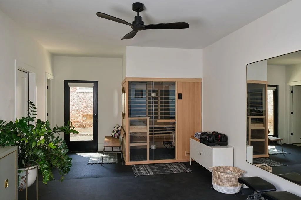 Custom home wellness room with sauna and fitness area in Atlanta's Old Fourth Ward near Ponce City Market.