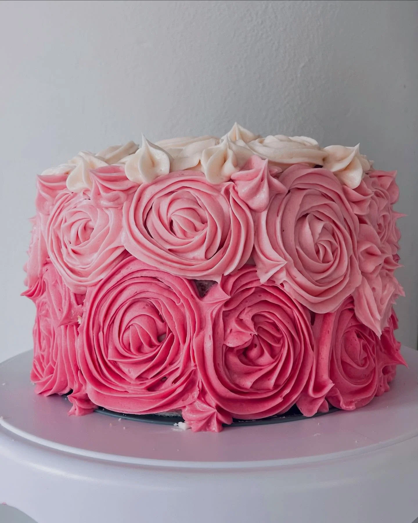 spring is springing! which means the blooms have made their way to this kitchen! a brown sugar cake with pink ombr&eacute; buttercream flora💖🌷🎂