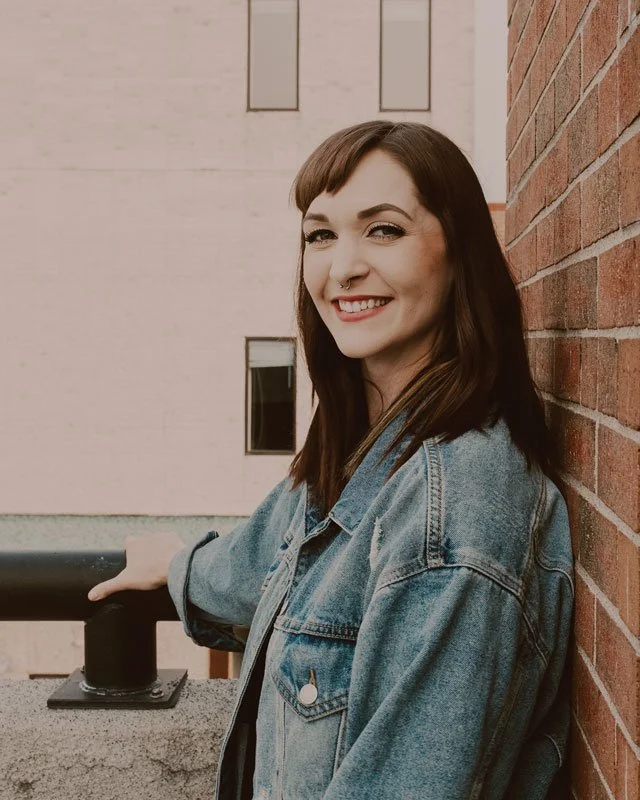 Abigail Paulson smiles at the camera.