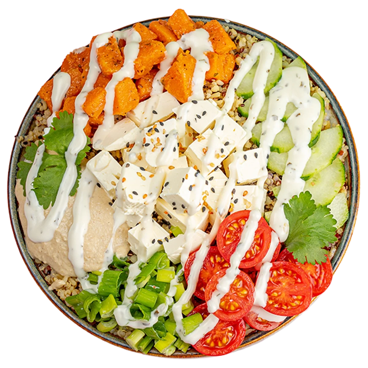 A colorful poke bowl with chopped sweet potatoes, cucumber slices, cherry tomatoes, cubed tofu, green onions, cilantro, and a dollop of hummus, all drizzled with a creamy white sauce.