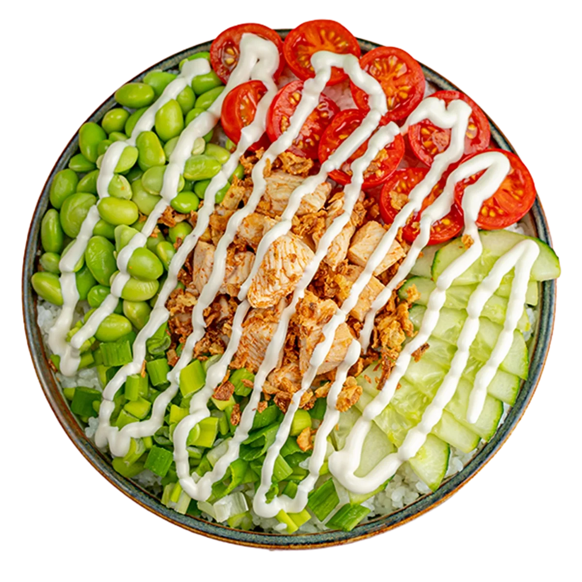 Bowl of rice topped with chopped green onions, edamame, shredded chicken, sliced cherry tomatoes, and sliced cucumber, drizzled with white sauce.