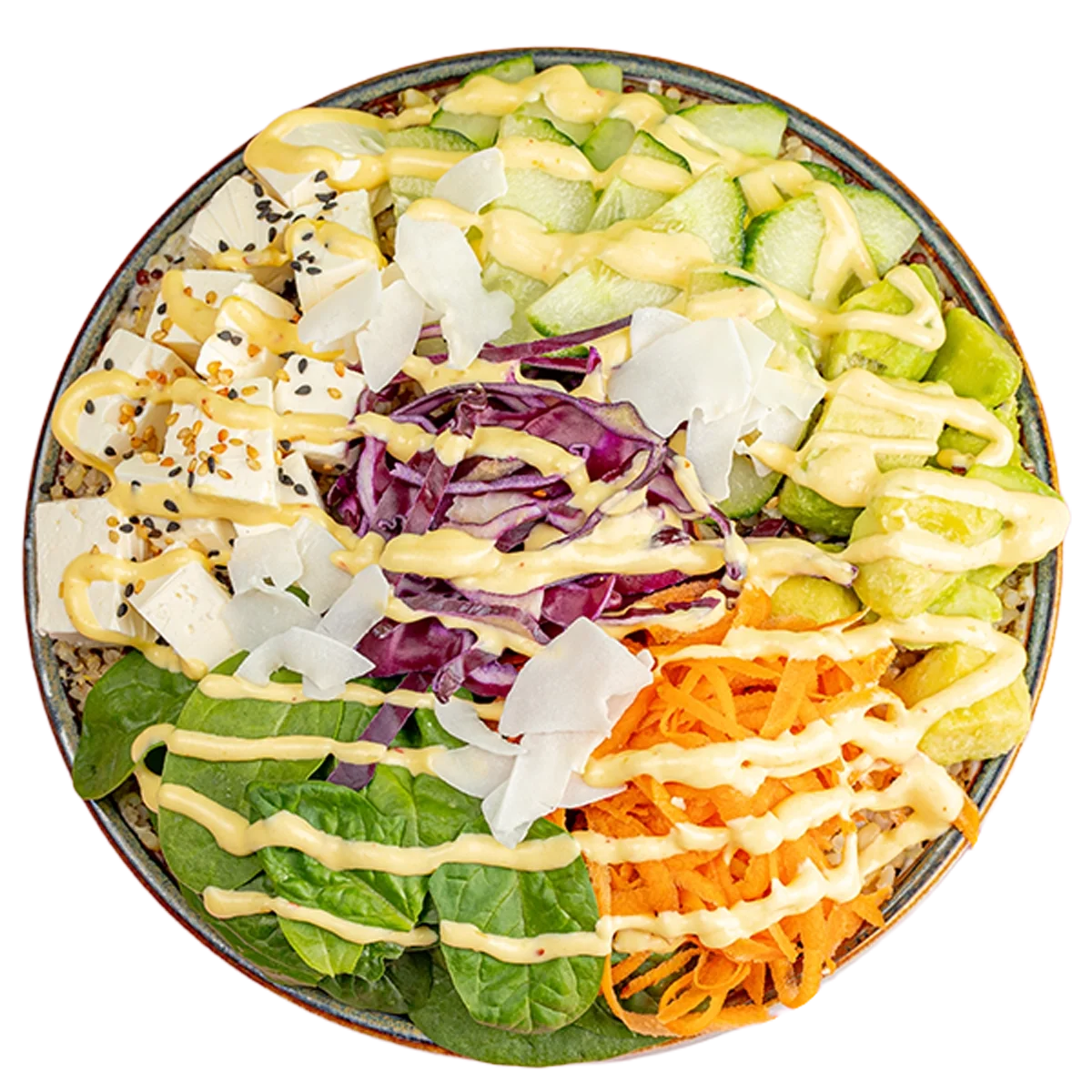 Close-up of a colorful salad with green lettuce, shredded carrots, cucumbers, purple cabbage, sliced zucchini, chopped tofu topped with sesame seeds, coconut flakes, and a drizzle of creamy dressing, in a round bowl.