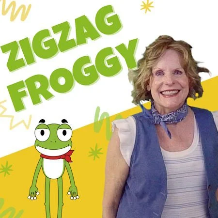 A women smiling next to a frog