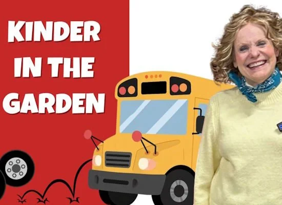 Smiling women next to a school bus