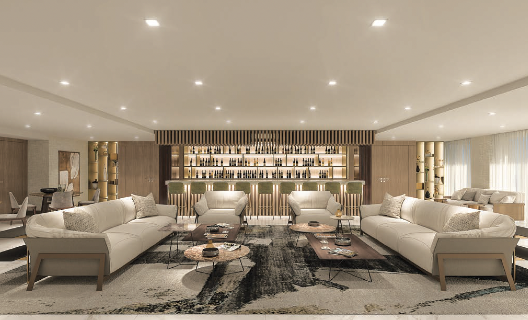 A spacious, modern lounge with beige sofas, armchairs, coffee tables, a black and beige rug, and a well-lit bar in the background with shelves of bottles, gold accents, and green bar stools. Naples avra aura metropolitan condos condominiums