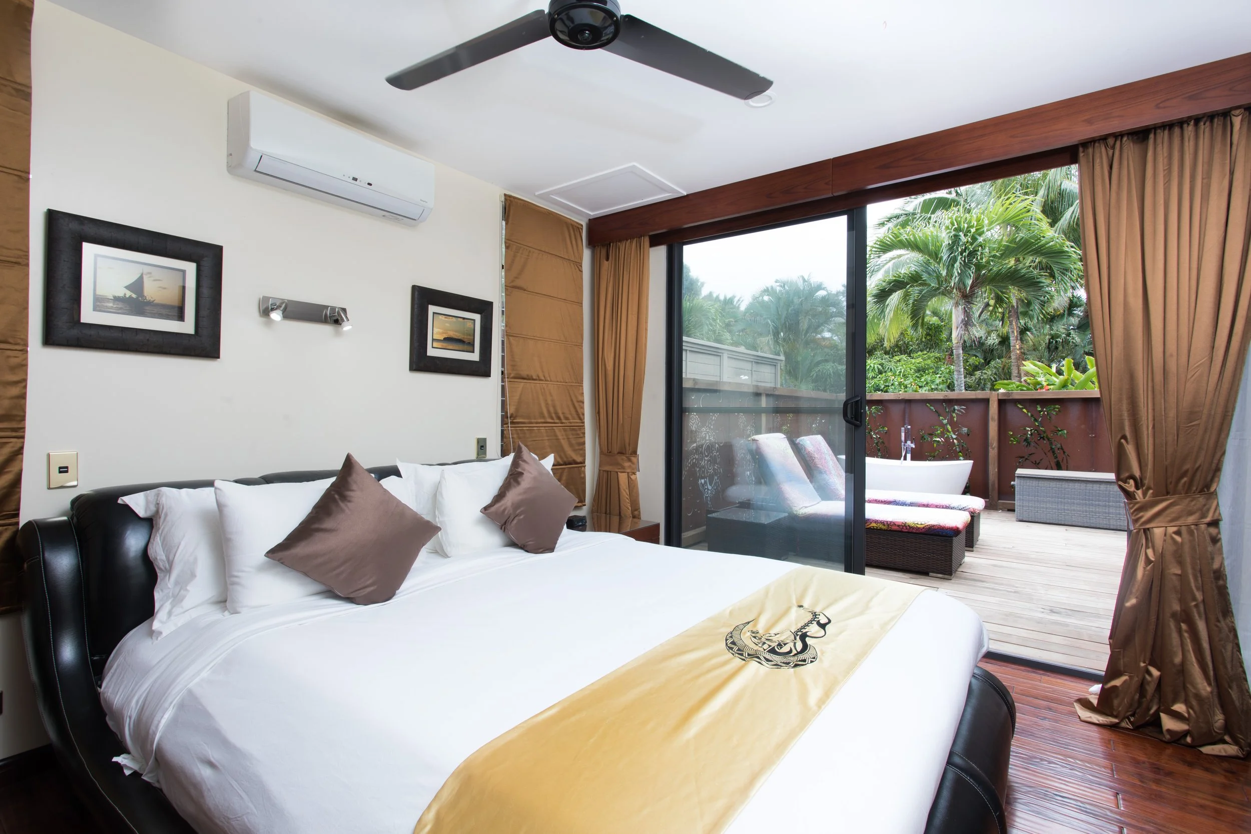 Villas 2 & 3 main bedroom with king-sized leather bed