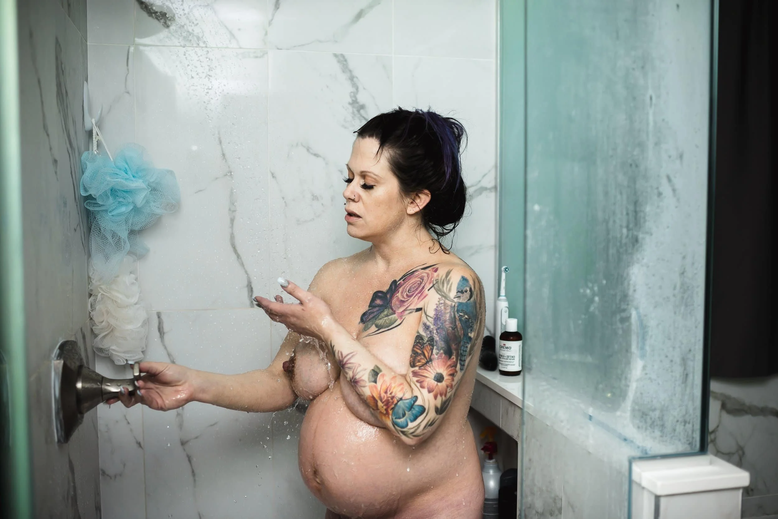 Woman in labour in shower during birth