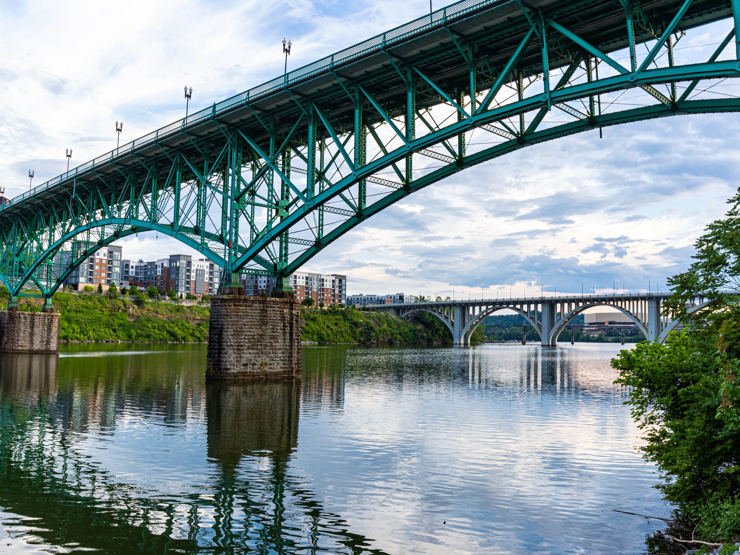 Gay Street Bridge in Knoxville, TN taken from the riverbank on a cloudy day.