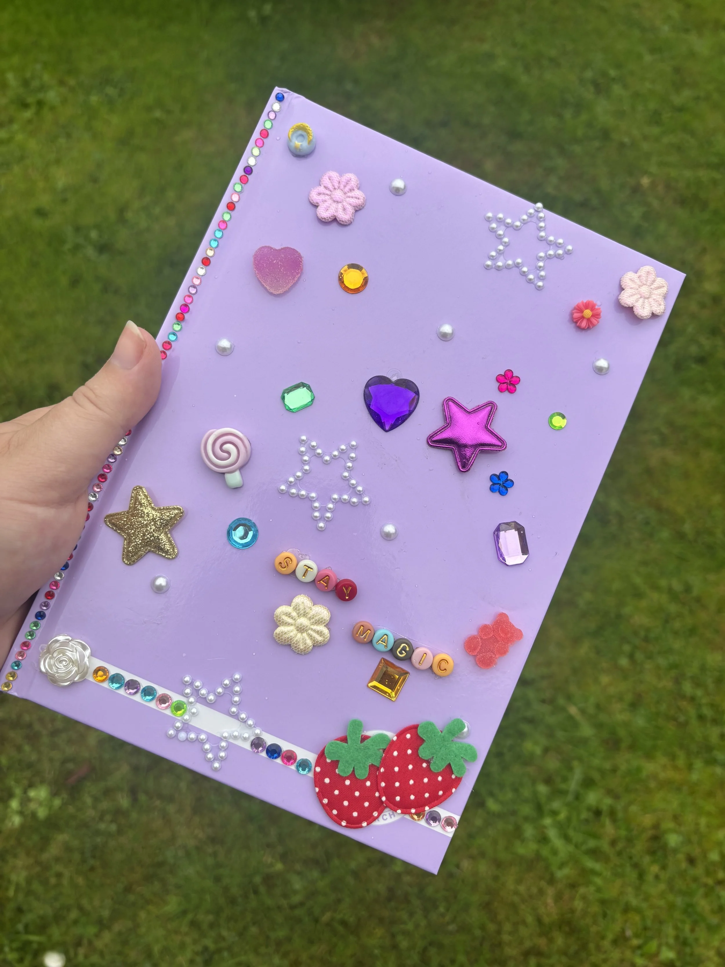 Decorated purple notebook with charms, rhinestones and beads