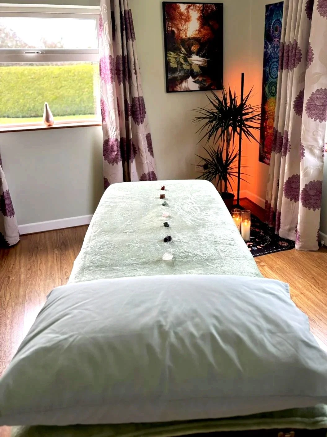 Calming room with massage table for Reiki and Rahanni sessions.
