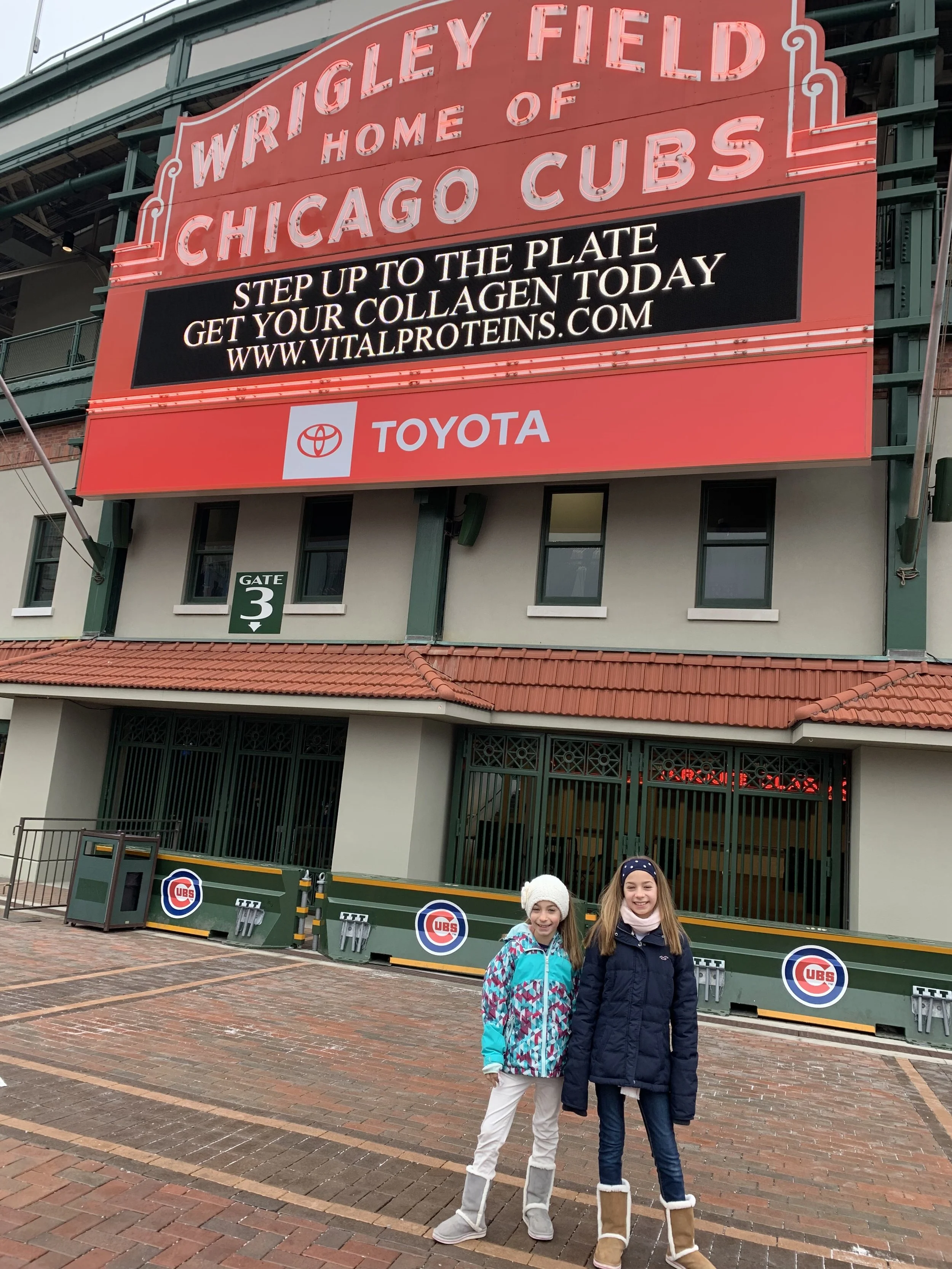 Family outside Wrigley Field Chicago Cubs stadium entrance