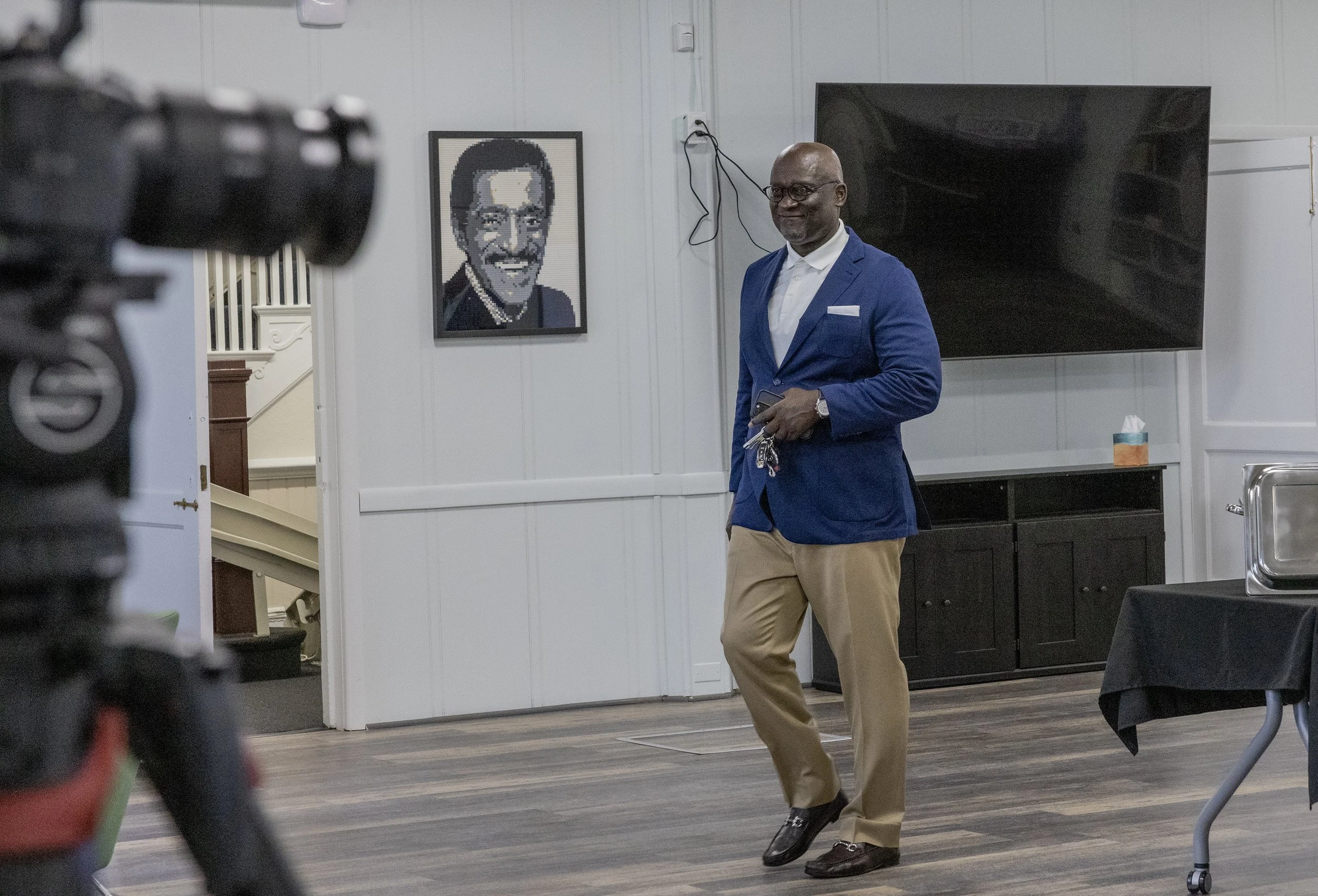 Dr. Terris King walking into a room.