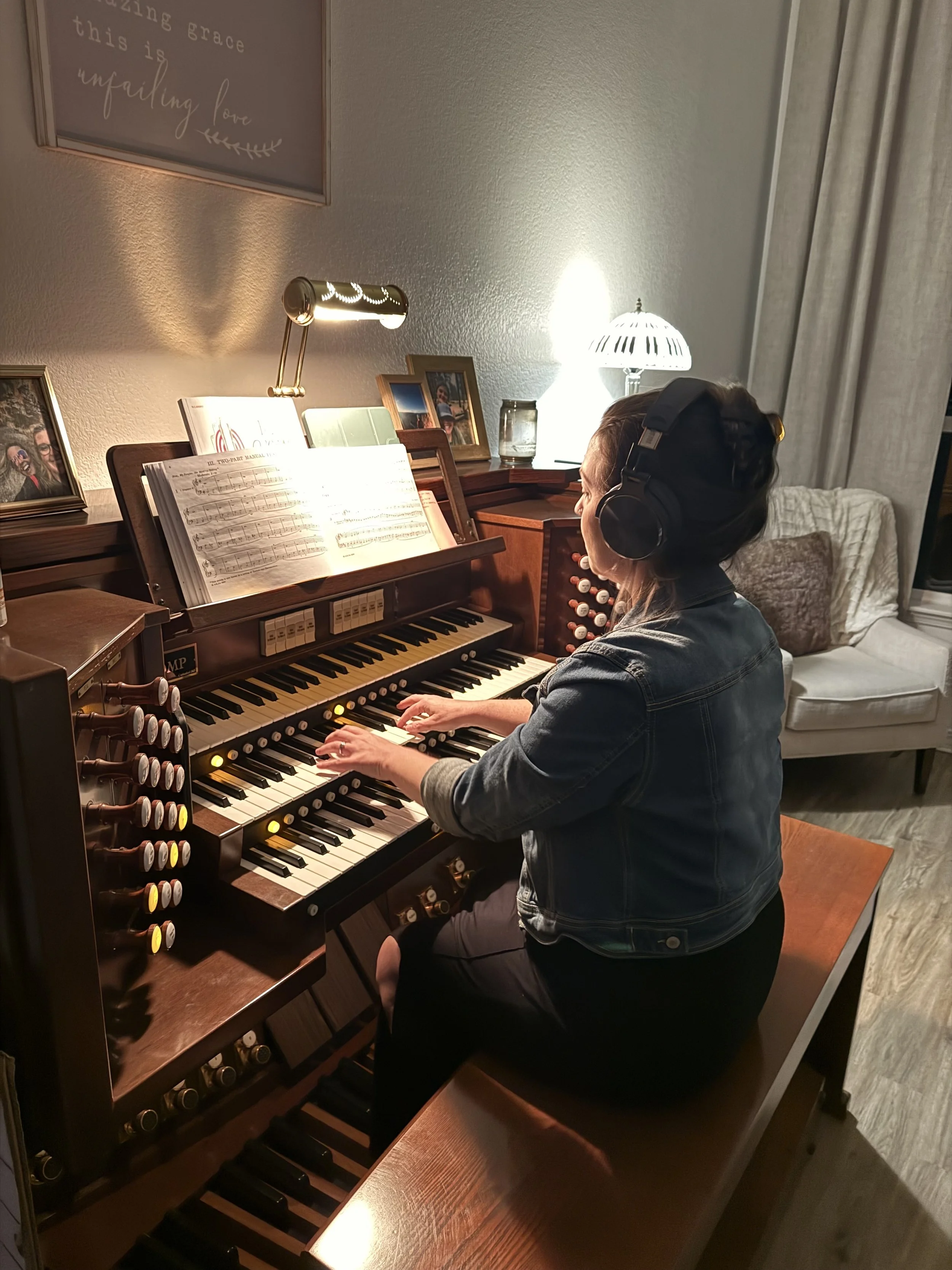 Brittany Brown practicing organ and preparing music in her home studio.