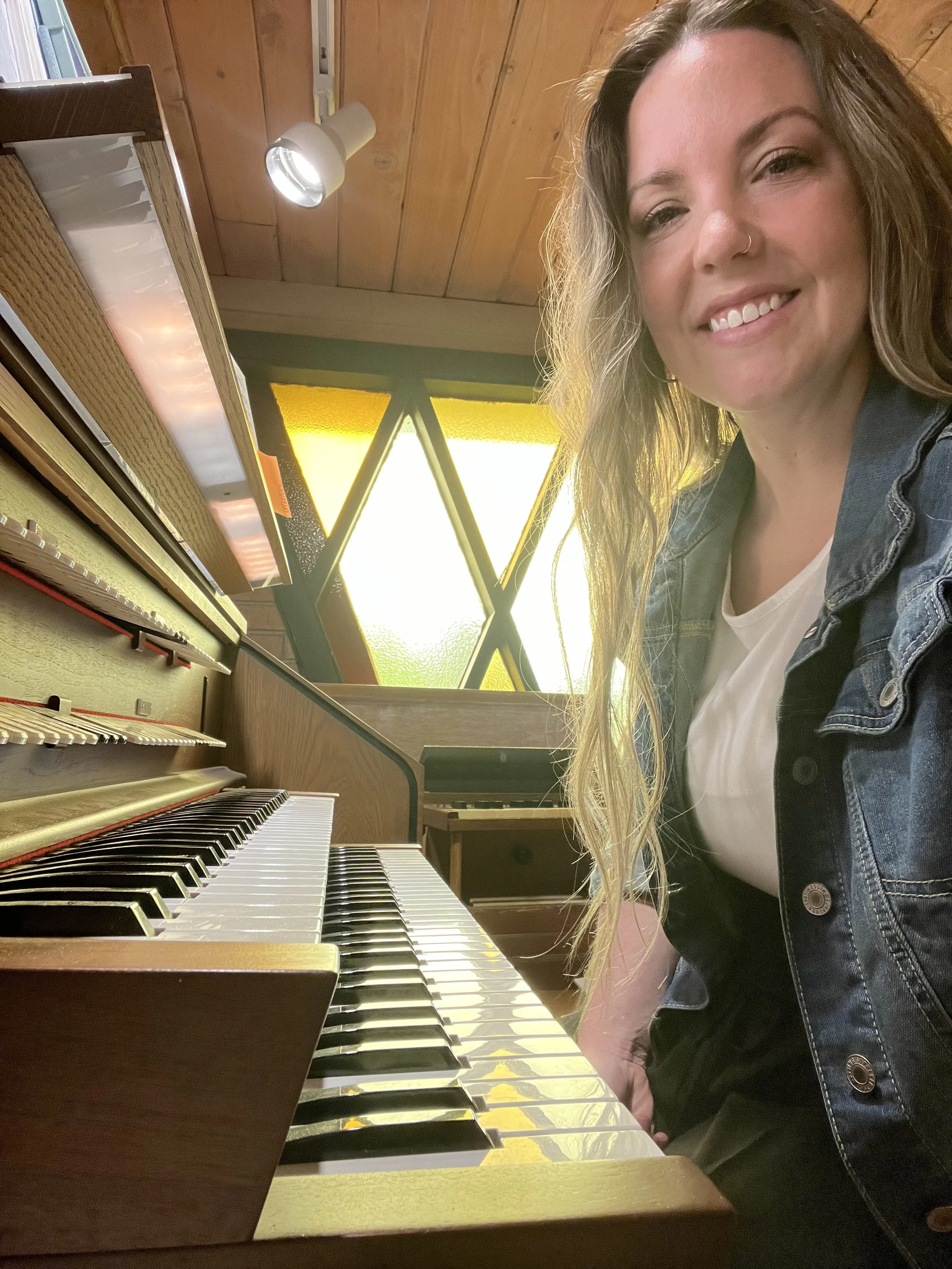 Brittany Brown playing piano and organ as an active musician and music educator.
